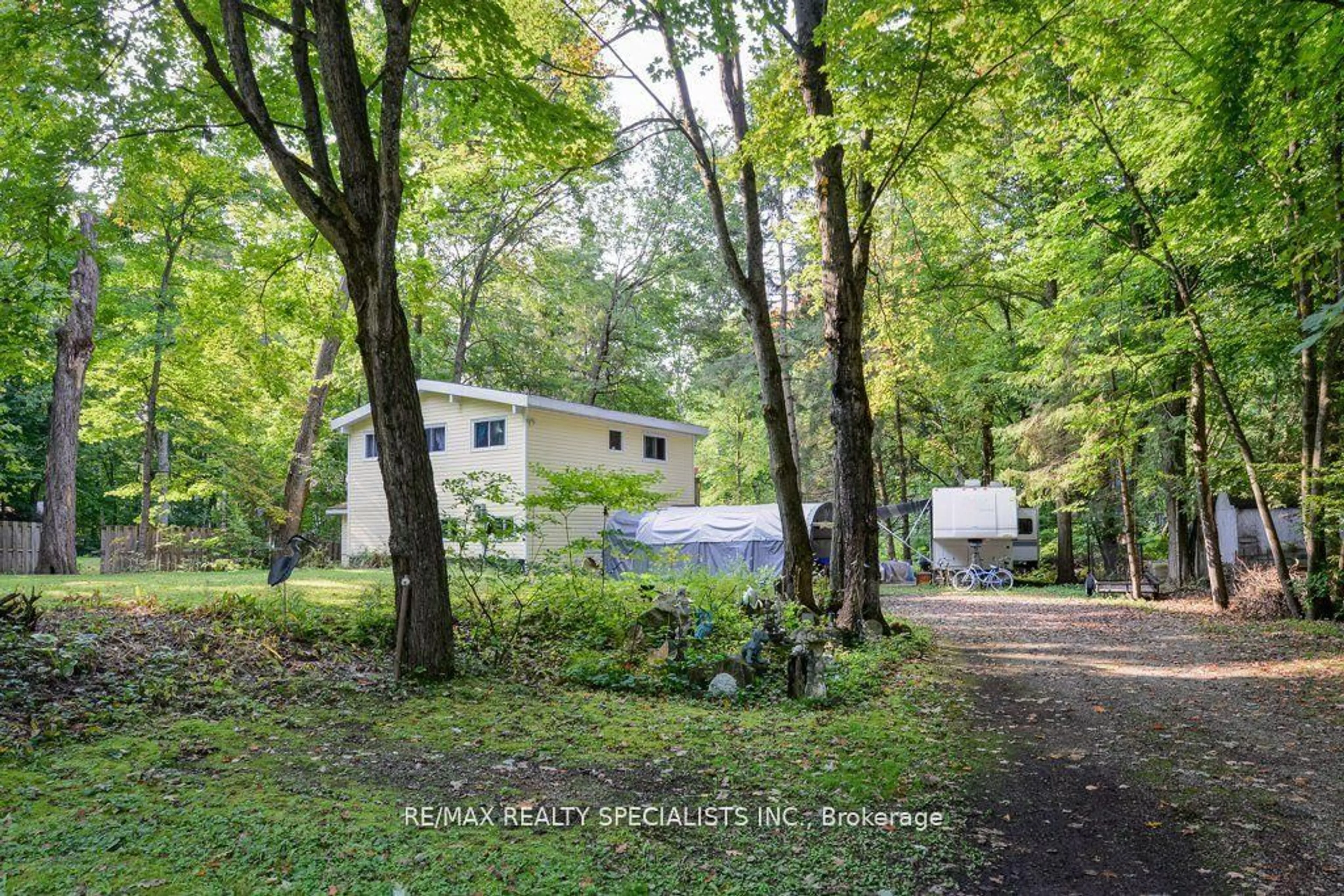 A pic from outside/outdoor area/front of a property/back of a property/a pic from drone, forest/trees view for 7468 Ash Cres, Ramara Ontario L0K 2B0