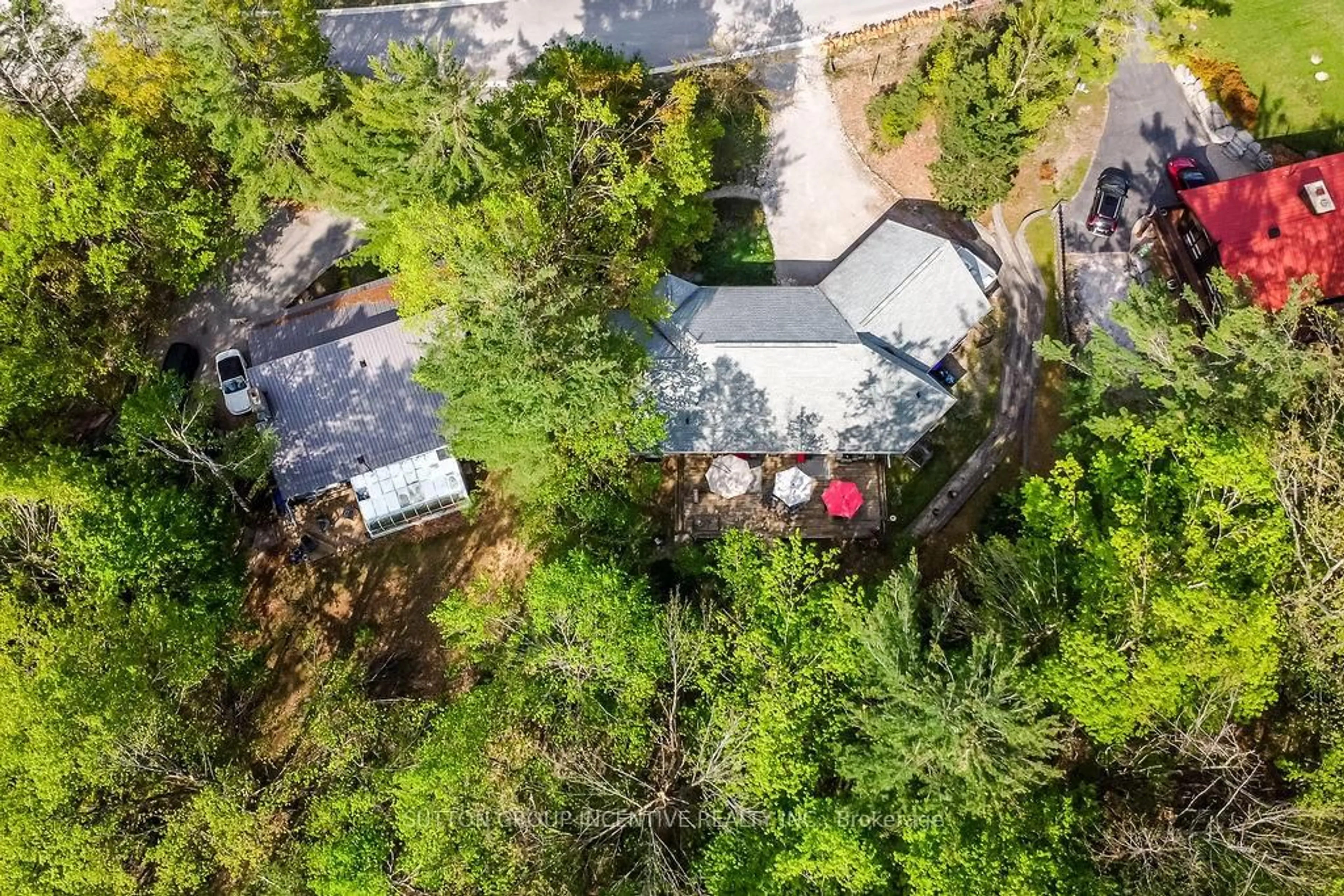 A pic from outside/outdoor area/front of a property/back of a property/a pic from drone, forest/trees view for 4 Country Club Lane, Oro-Medonte Ontario L4M 4Y8