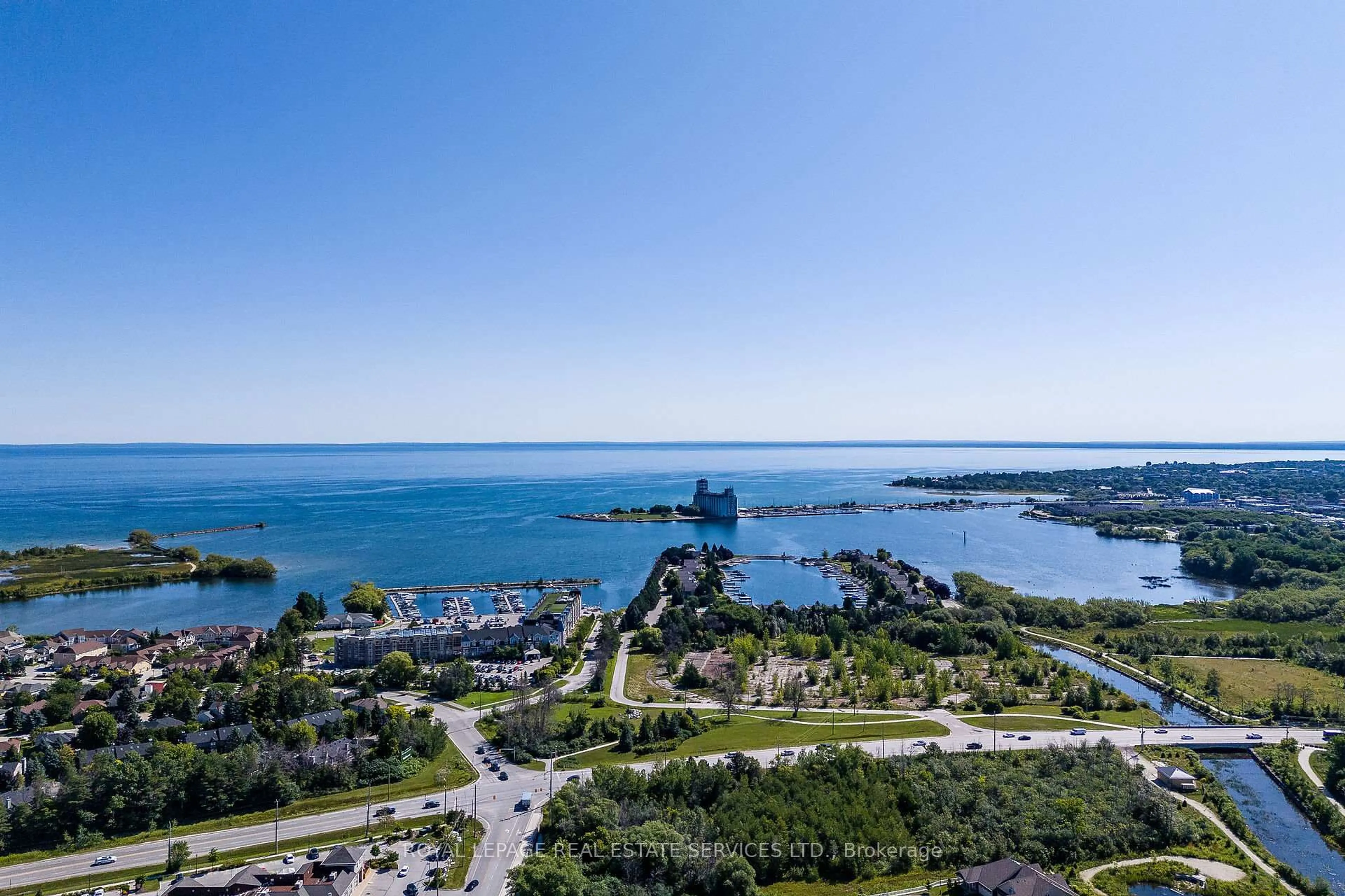 A pic from outside/outdoor area/front of a property/back of a property/a pic from drone, water/lake/river/ocean view for 4 Kimberly Lane #127, Collingwood Ontario L9Y 5K8