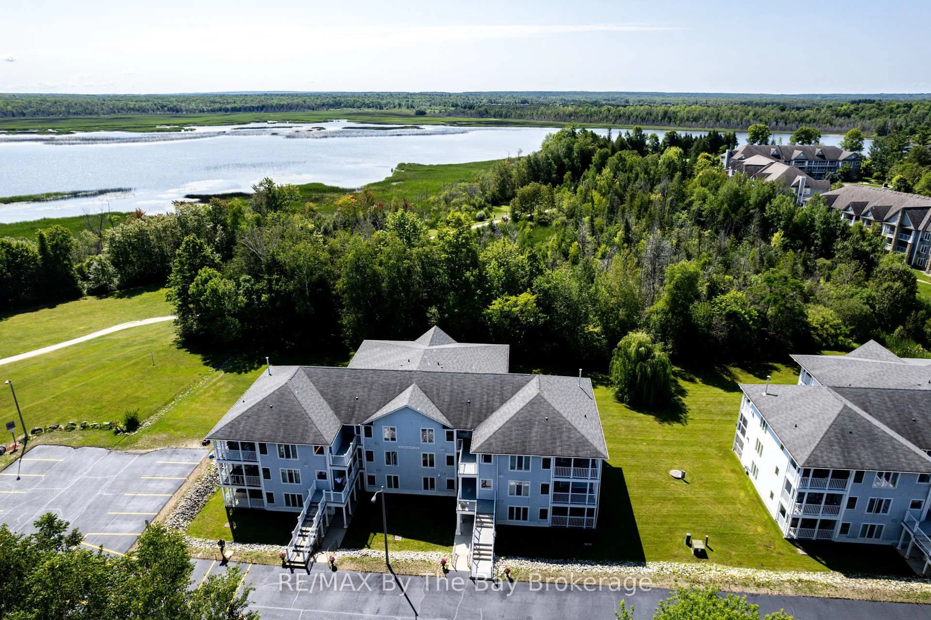 A pic from outside/outdoor area/front of a property/back of a property/a pic from drone, water/lake/river/ocean view for 10 Mulligan Lane #6, Wasaga Beach Ontario L9Z 1C4