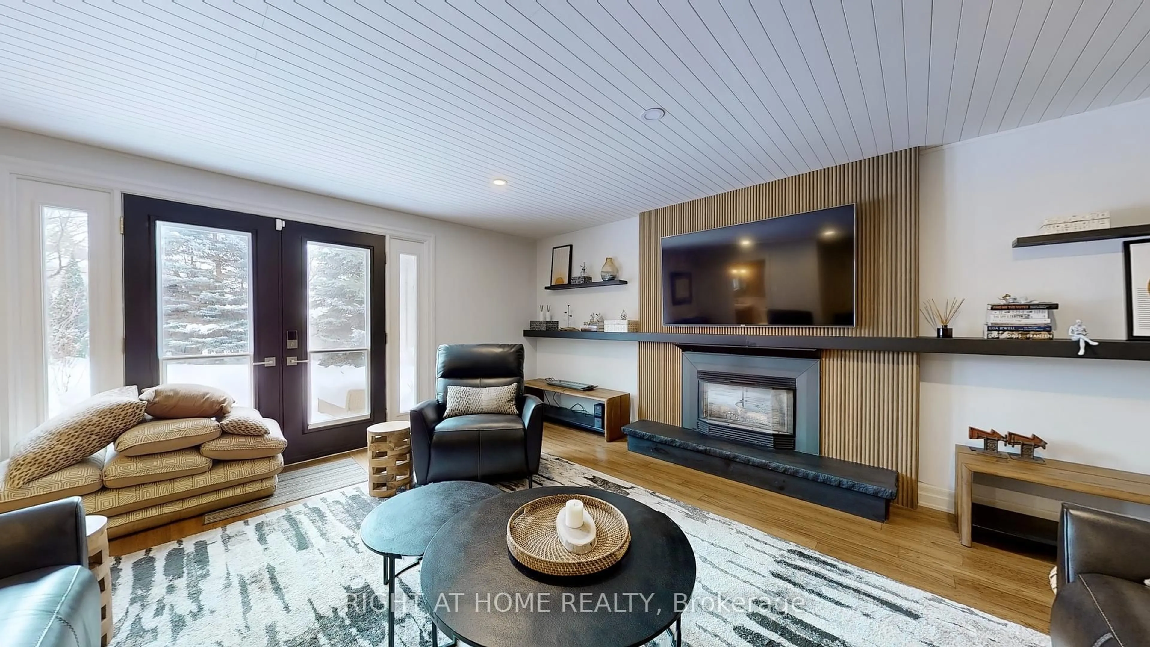 Living room with furniture, wood/laminate floor for 127 Puget St, Barrie Ontario L4M 4N6