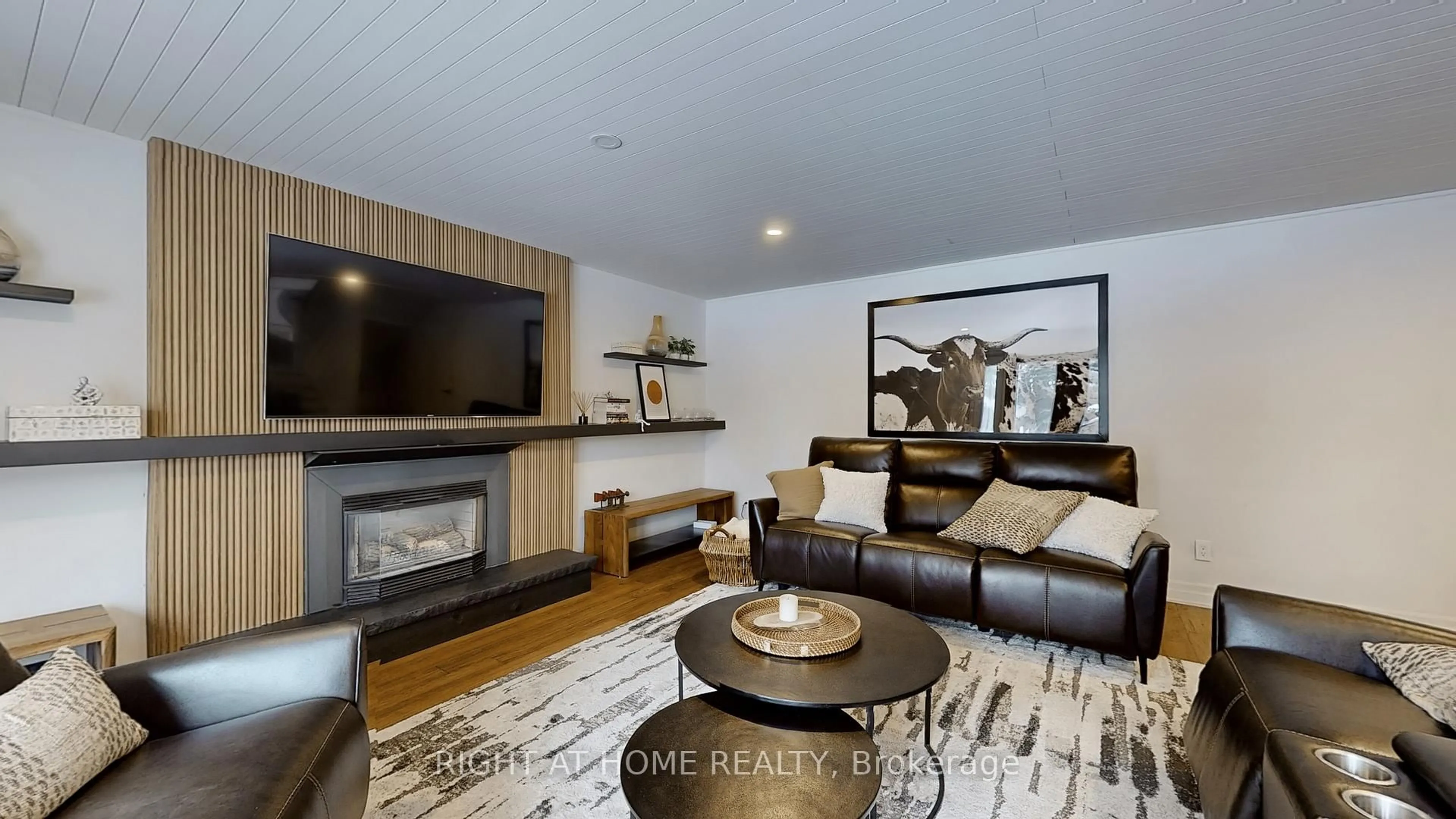 Living room with furniture, wood/laminate floor for 127 Puget St, Barrie Ontario L4M 4N6