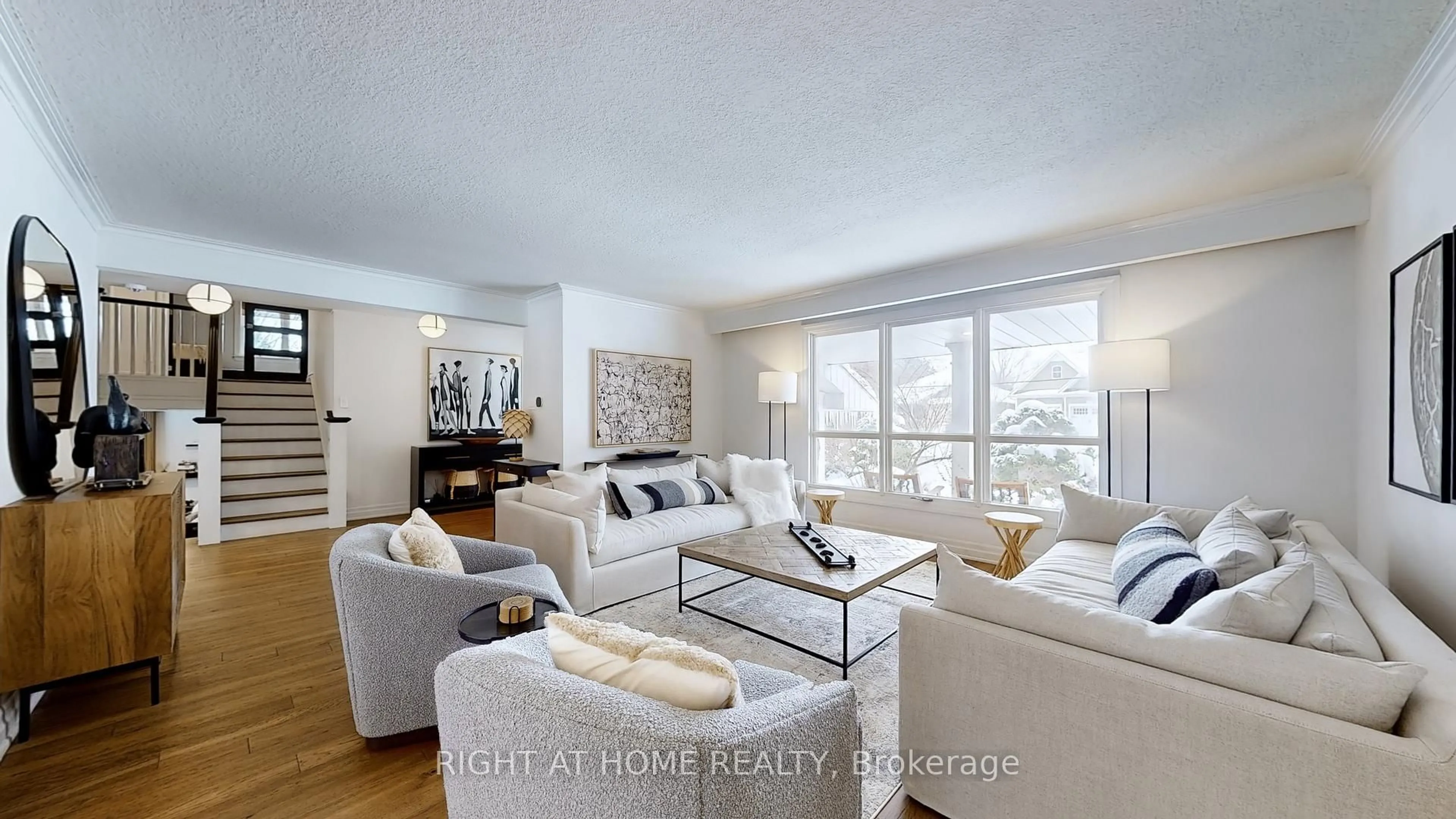 Living room with furniture, wood/laminate floor for 127 Puget St, Barrie Ontario L4M 4N6