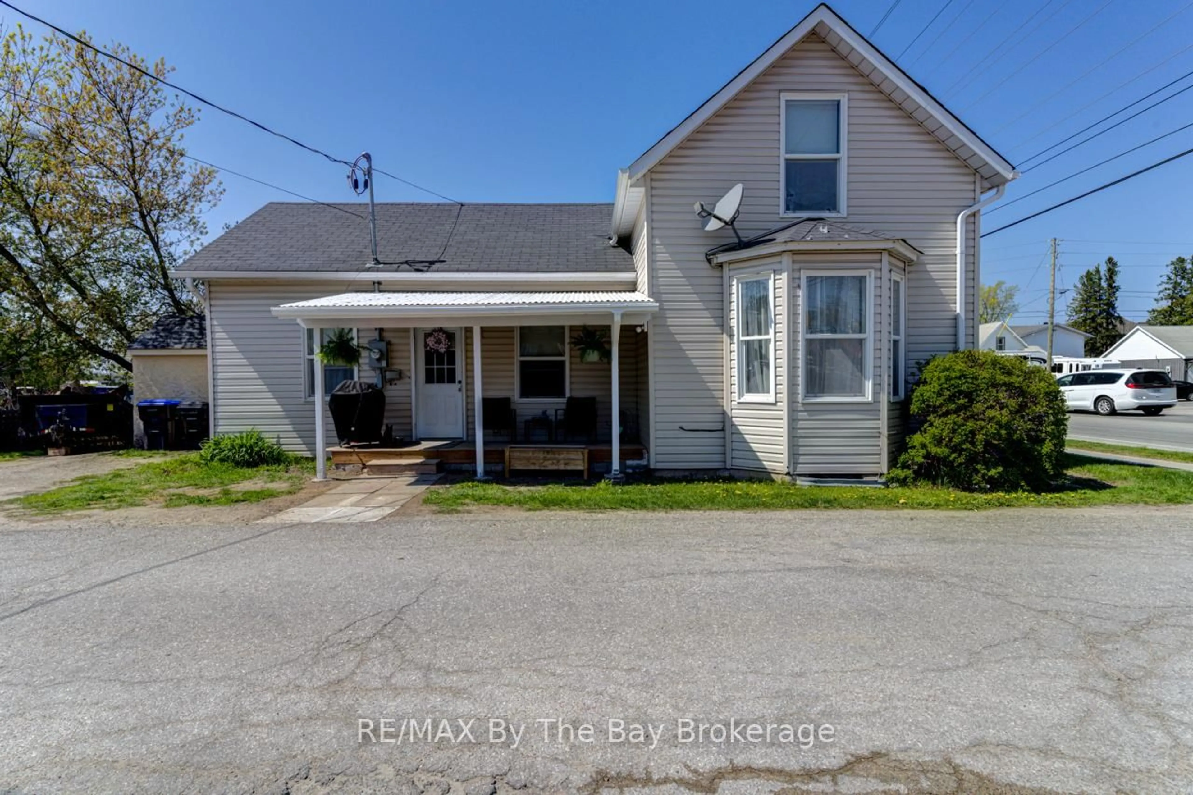 A pic from outside/outdoor area/front of a property/back of a property/a pic from drone, street for 16 Yonge St, Springwater Ontario L0L 1P0