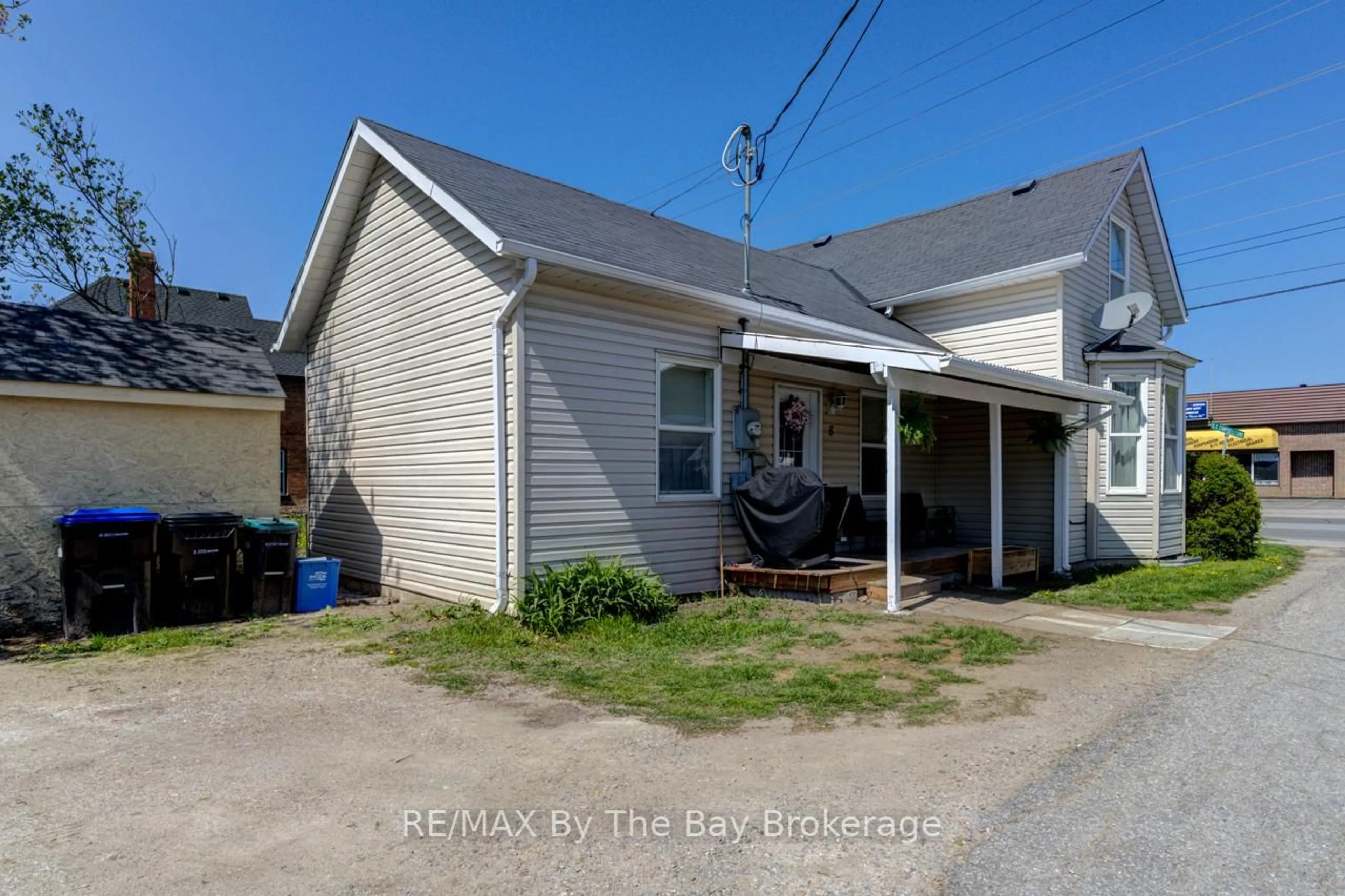 A pic from outside/outdoor area/front of a property/back of a property/a pic from drone, street for 16 Yonge St, Springwater Ontario L0L 1P0