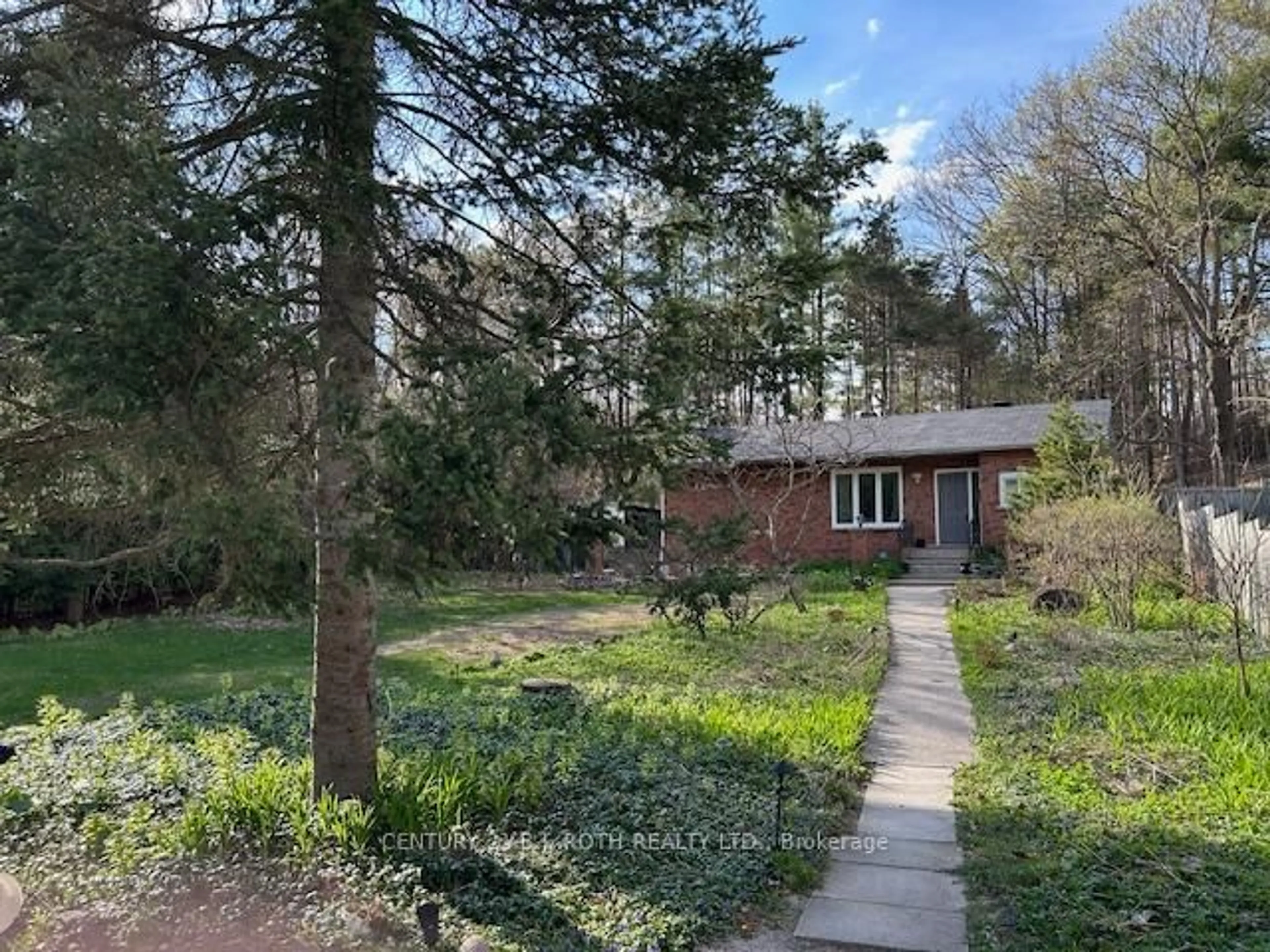 A pic from outside/outdoor area/front of a property/back of a property/a pic from drone, forest/trees view for 86 Doran Rd, Springwater Ontario L0L 1X0