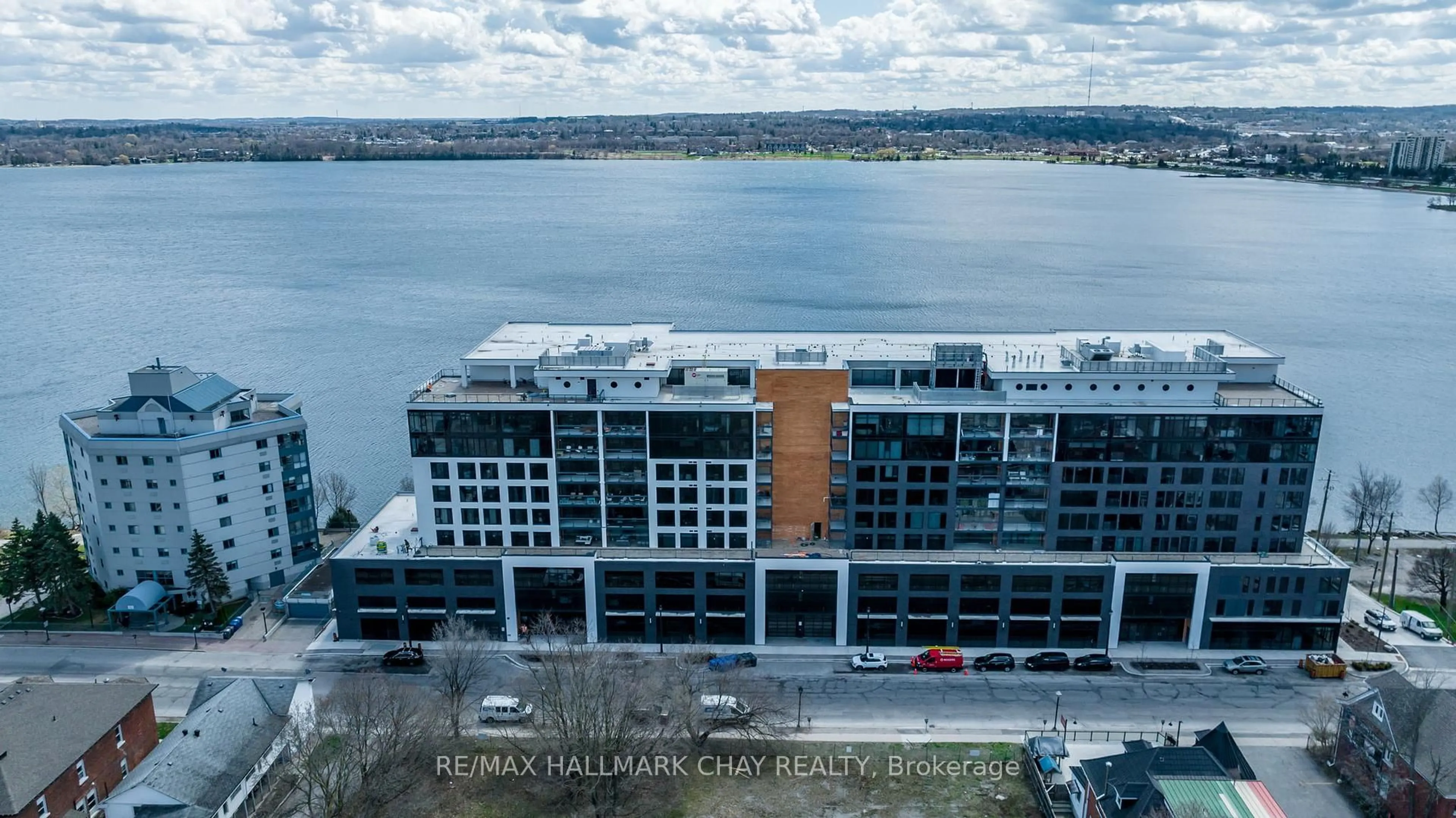 A pic from outside/outdoor area/front of a property/back of a property/a pic from drone, water/lake/river/ocean view for 185 Dunlop St #PH07, Barrie Ontario L4M 1B2