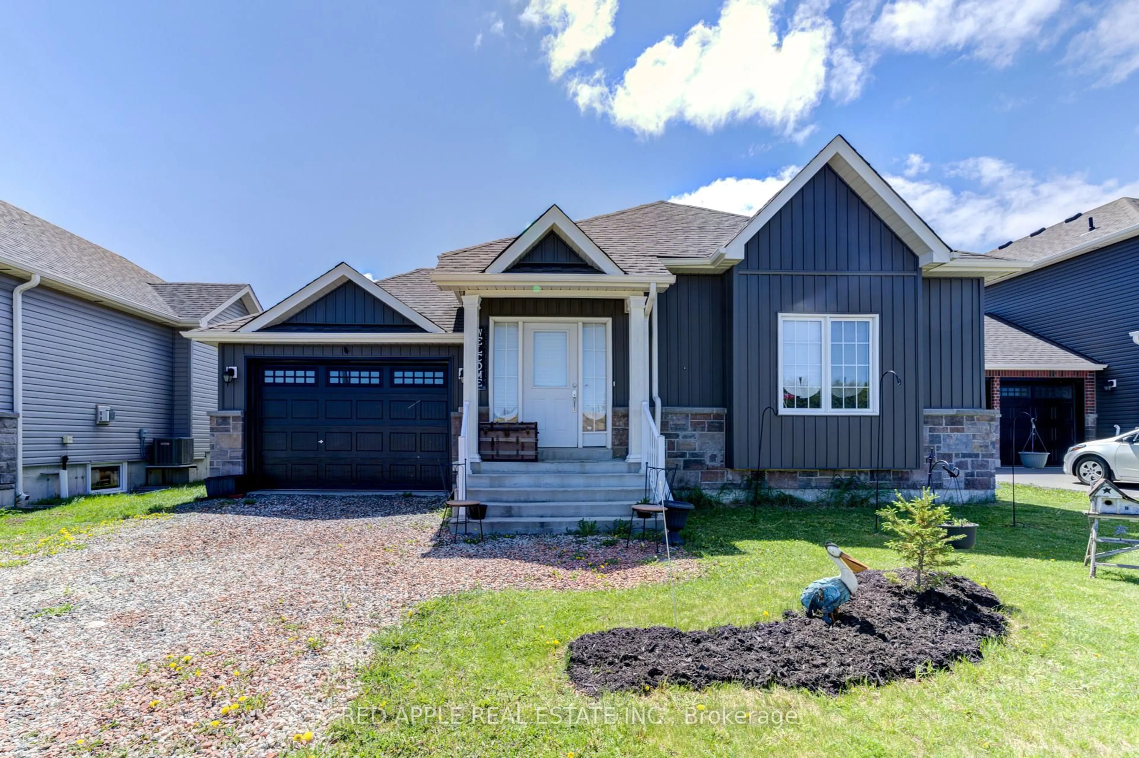 Home with vinyl exterior material, street for 5 Beverly St, Springwater Ontario L0L 1P0