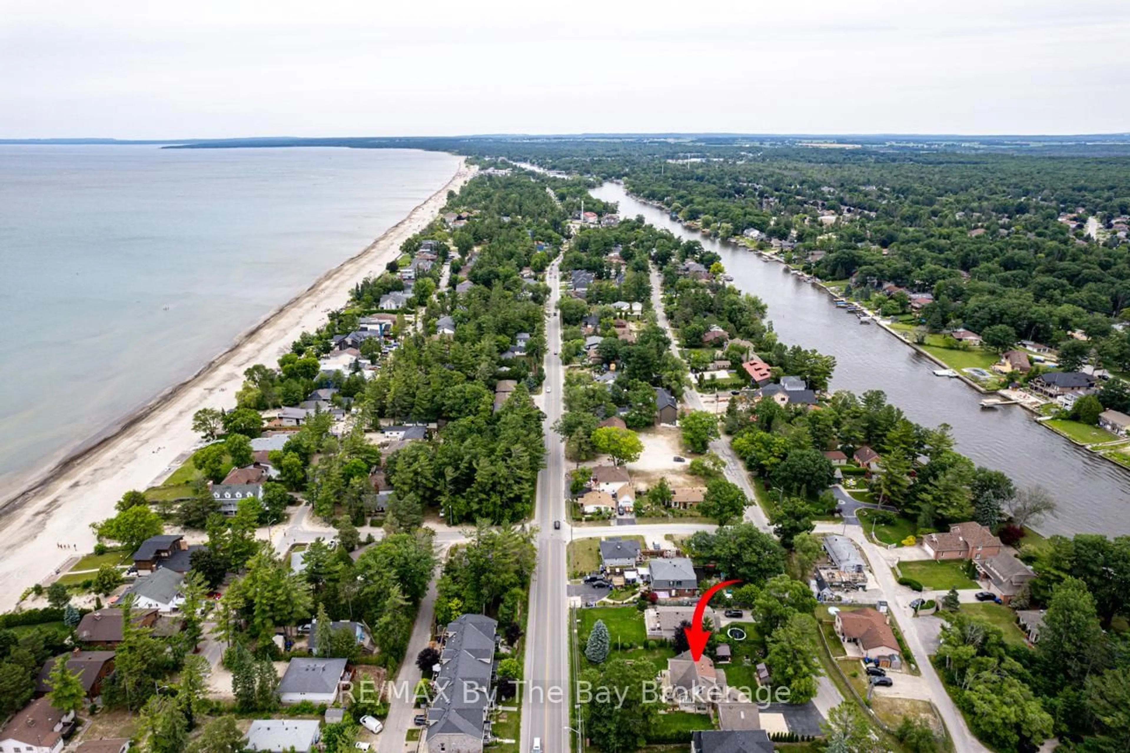 A pic from outside/outdoor area/front of a property/back of a property/a pic from drone, water/lake/river/ocean view for 599 MOSLEY St, Wasaga Beach Ontario L9Z 2J2