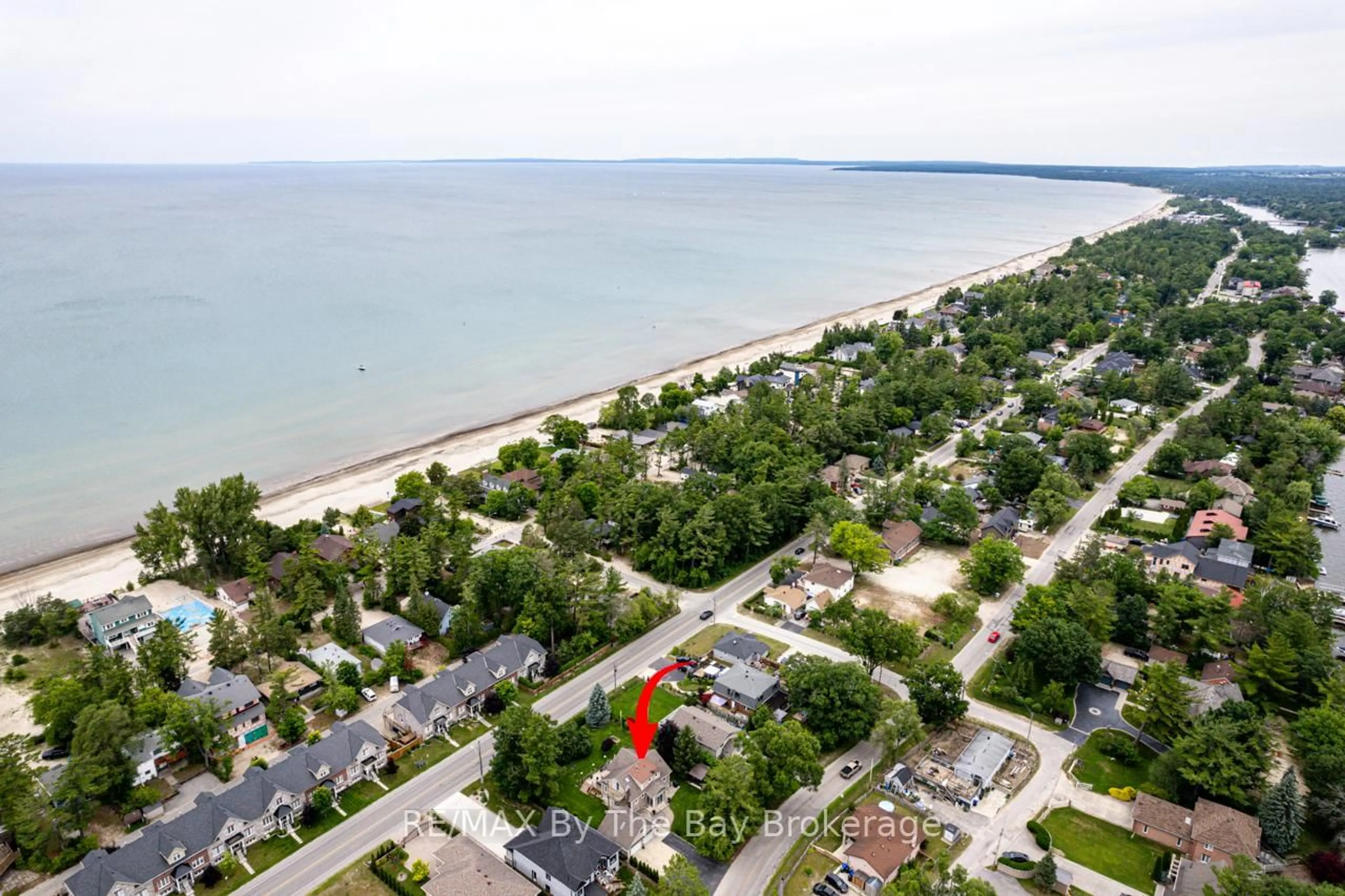 A pic from outside/outdoor area/front of a property/back of a property/a pic from drone, water/lake/river/ocean view for 599 MOSLEY St, Wasaga Beach Ontario L9Z 2J2