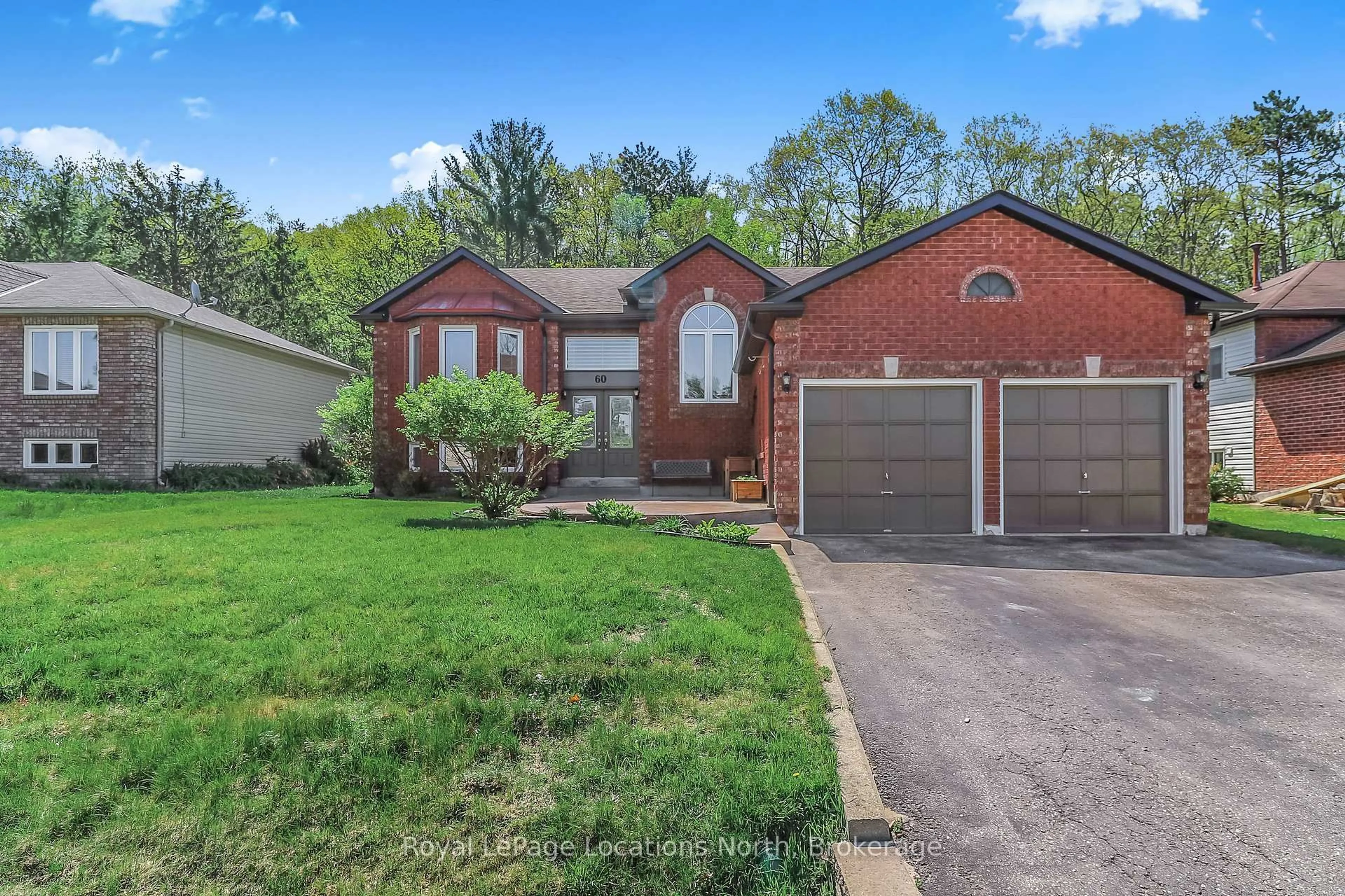 Home with brick exterior material, street for 60 Leo Blvd, Wasaga Beach Ontario L9Z 1C6