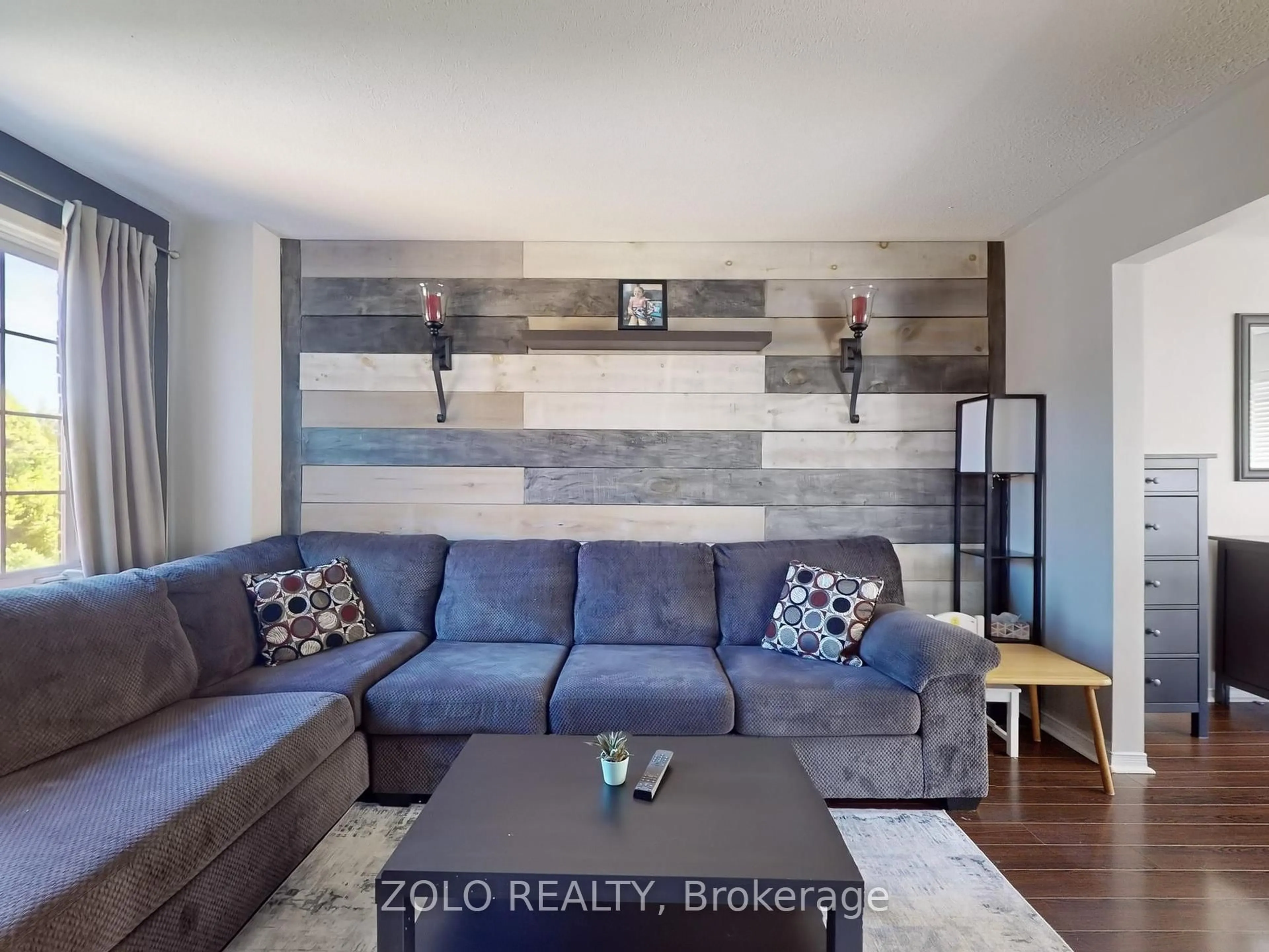 Living room with furniture, wood/laminate floor for 45 Athabaska Rd, Barrie Ontario L4N 8E8