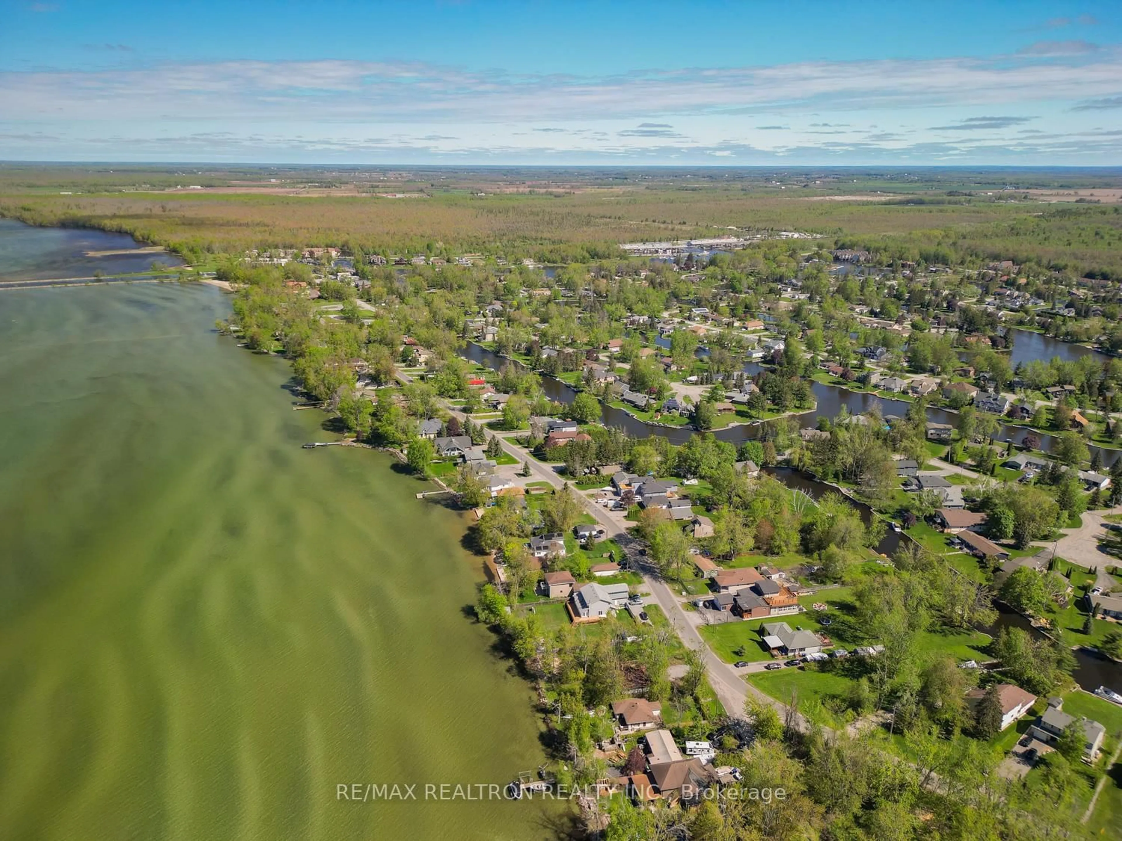 A pic from outside/outdoor area/front of a property/back of a property/a pic from drone, water/lake/river/ocean view for 31 Lake Ave, Ramara Ontario L0K 1B0