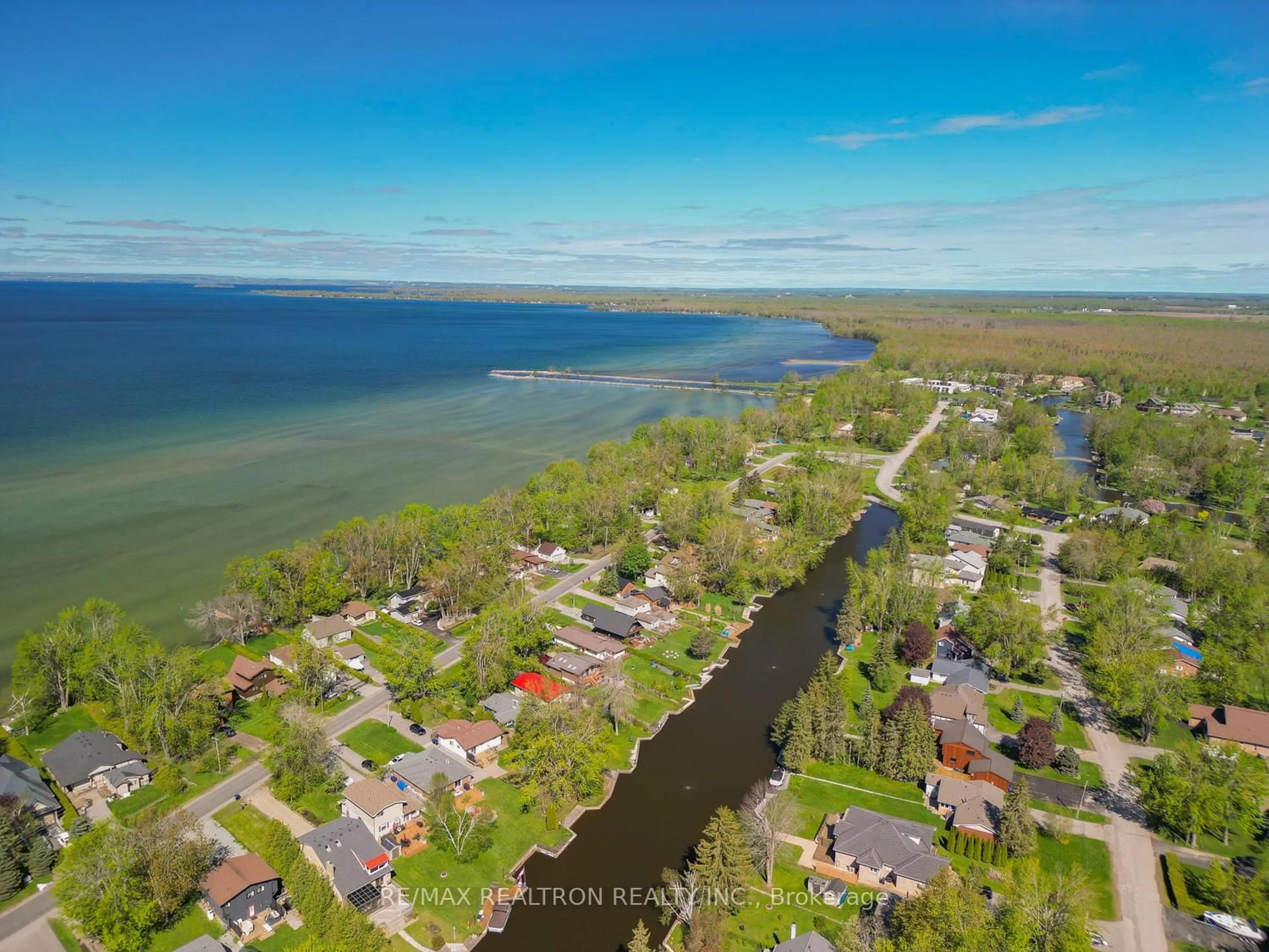 A pic from outside/outdoor area/front of a property/back of a property/a pic from drone, water/lake/river/ocean view for 31 Lake Ave, Ramara Ontario L0K 1B0
