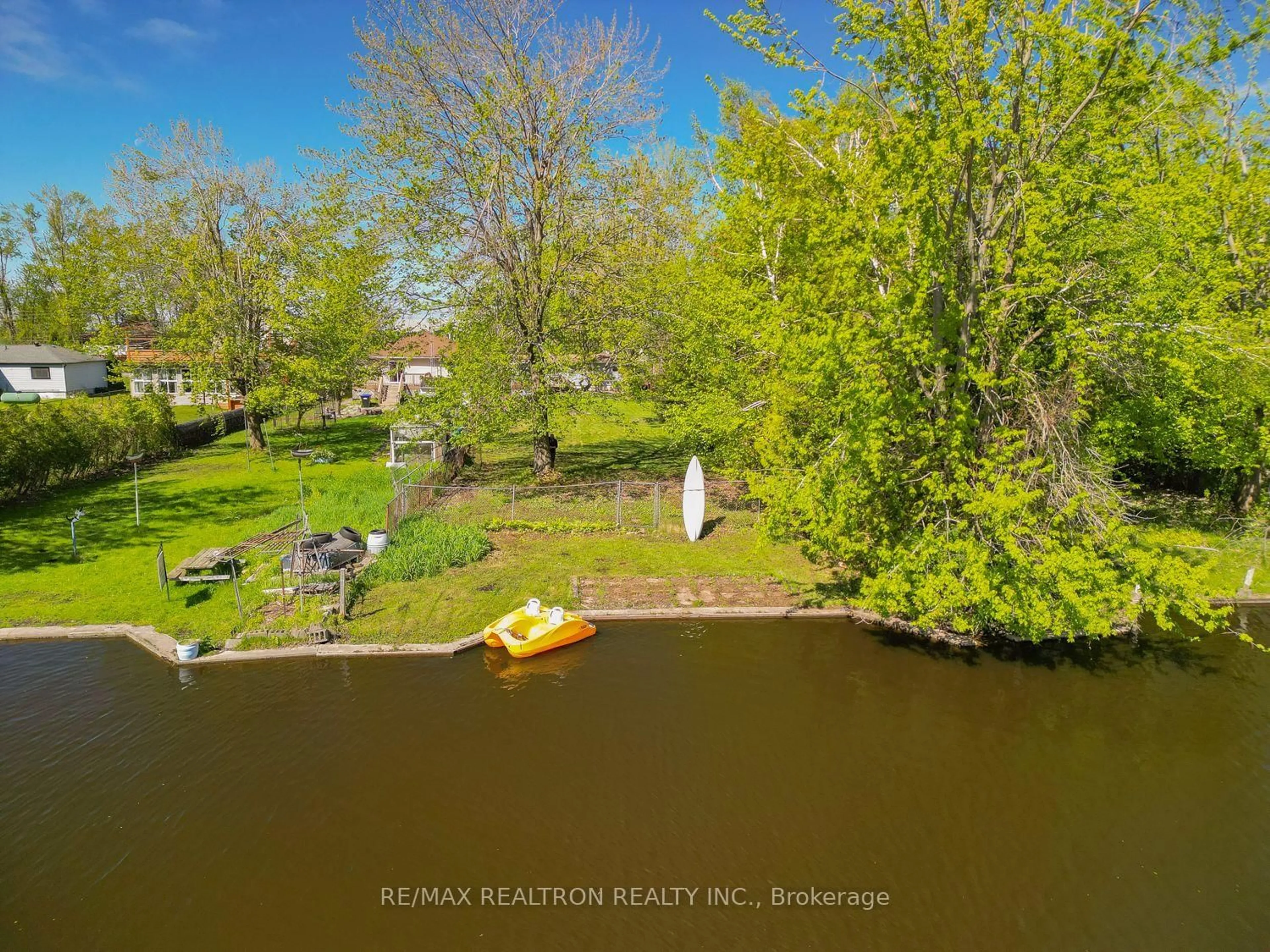 A pic from outside/outdoor area/front of a property/back of a property/a pic from drone, water/lake/river/ocean view for 31 Lake Ave, Ramara Ontario L0K 1B0