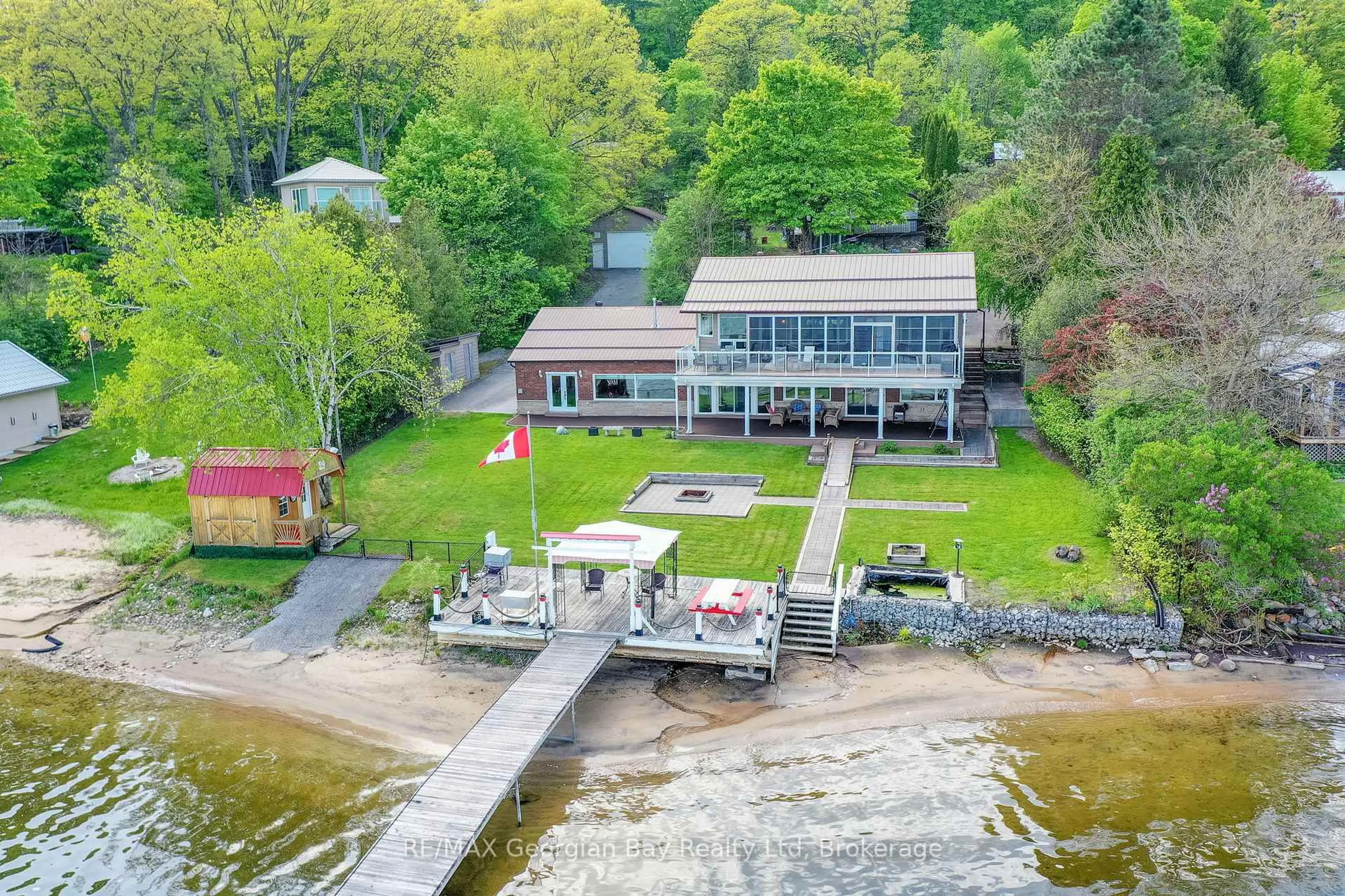 A pic from outside/outdoor area/front of a property/back of a property/a pic from drone, water/lake/river/ocean view for 405 Champlain Rd, Penetanguishene Ontario L9M 1S3