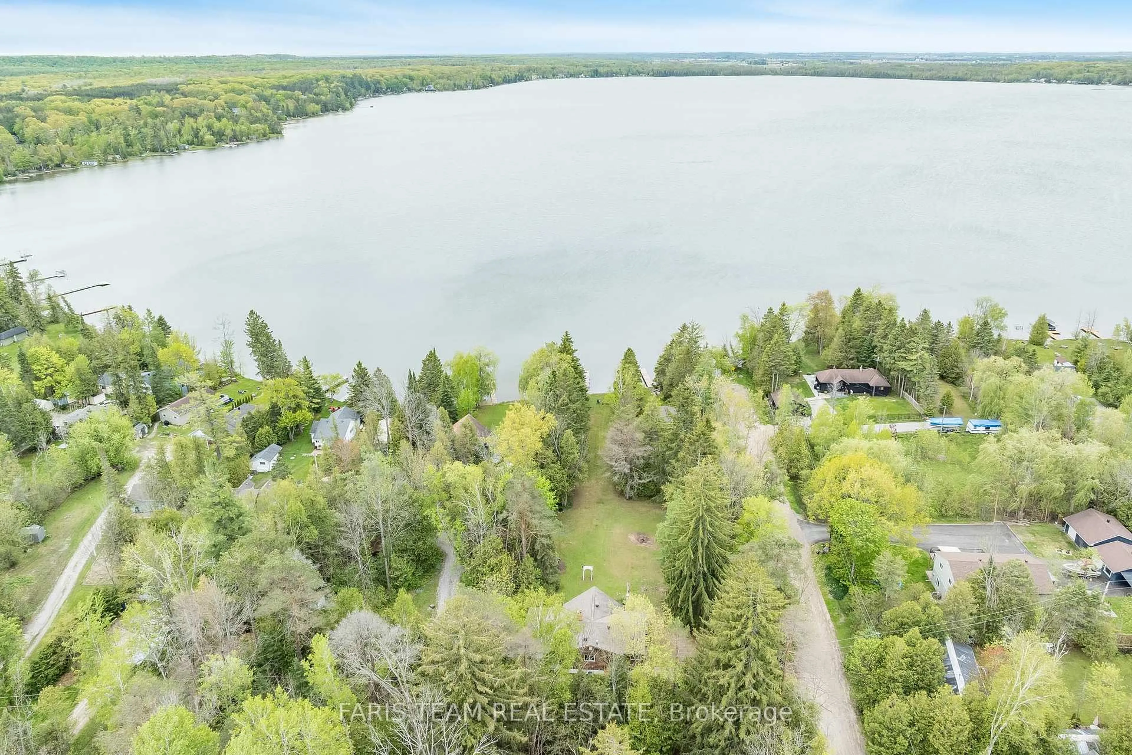 A pic from outside/outdoor area/front of a property/back of a property/a pic from drone, water/lake/river/ocean view for 2385 Whetham Rd, Springwater Ontario L0L 1P0