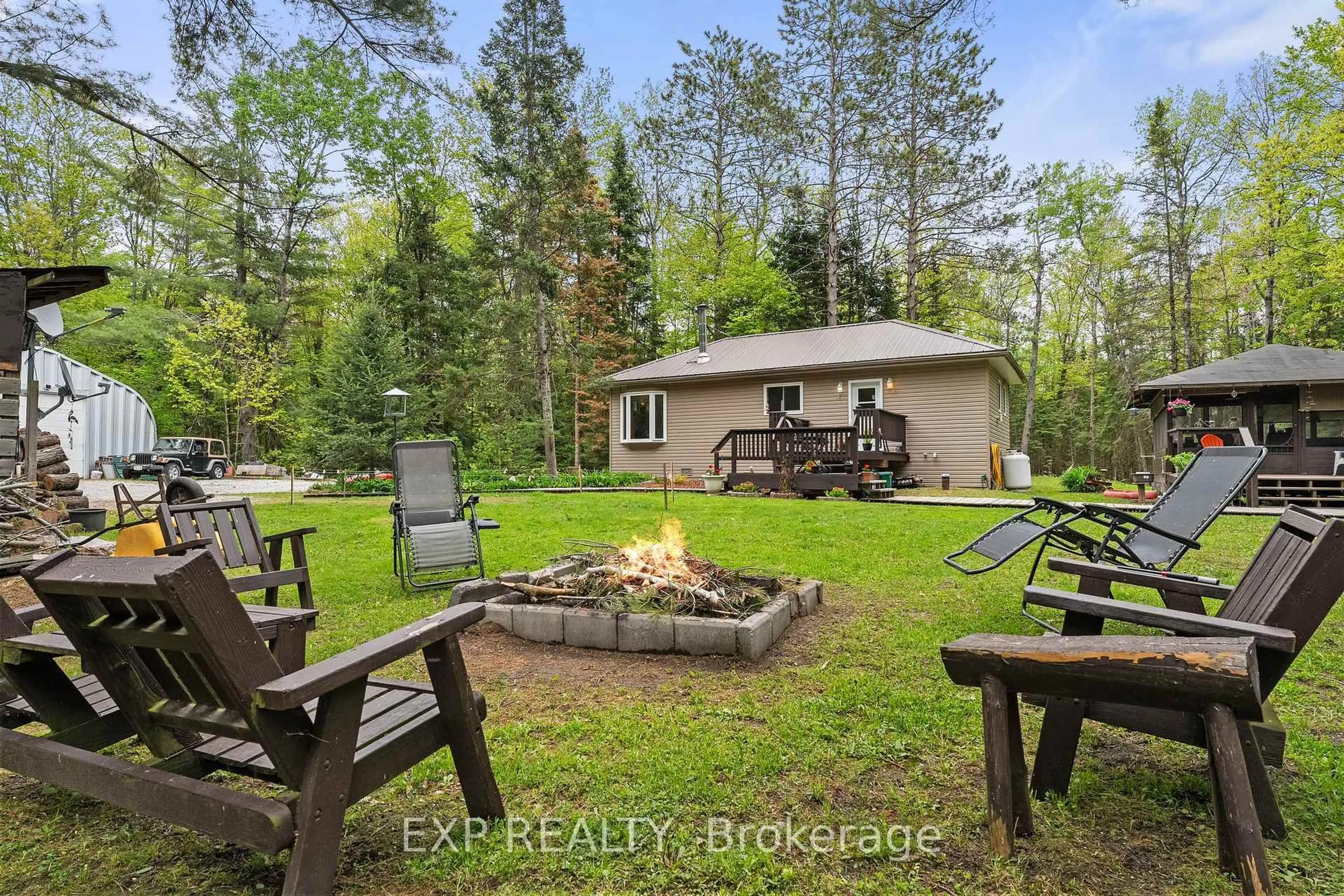 Patio, forest/trees view for 6566 Pioneer Village Lane, Ramara Ontario L0K 1W0