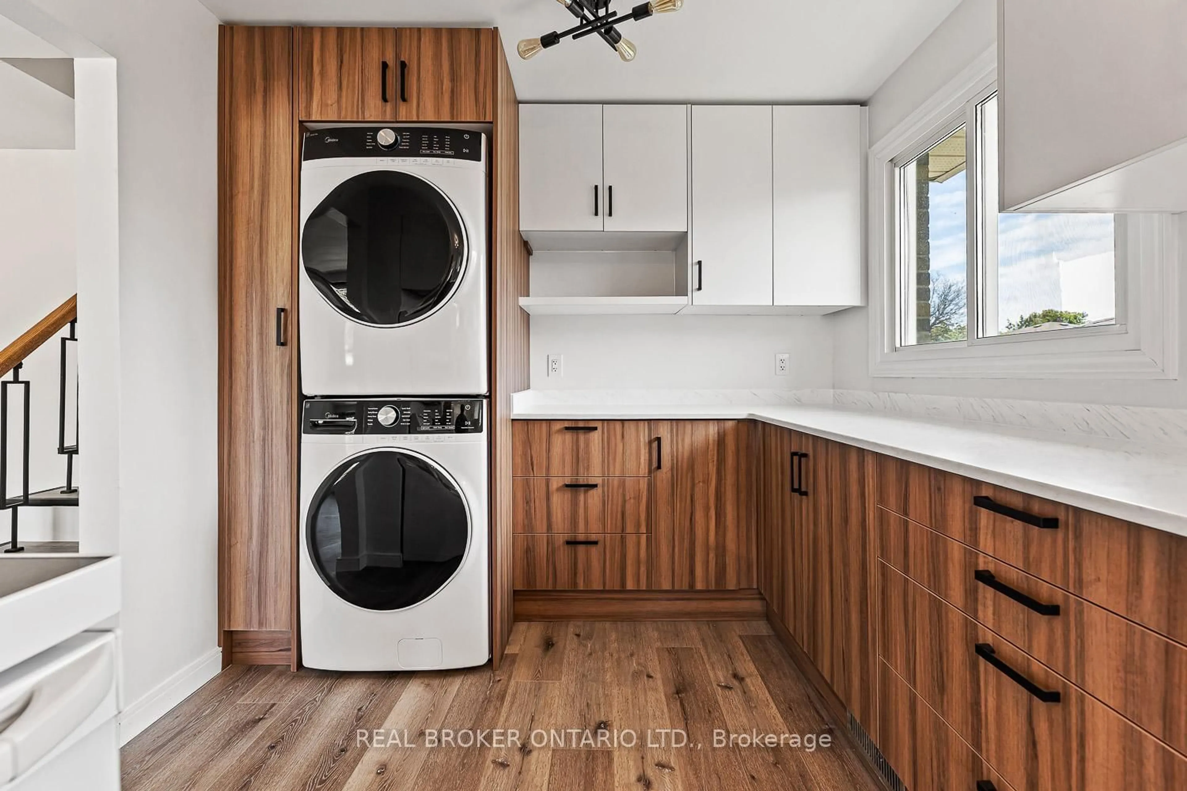 Kitchen with laundary machines, wood/laminate floor for 56 Bernick Dr, Barrie Ontario L4M 2V5