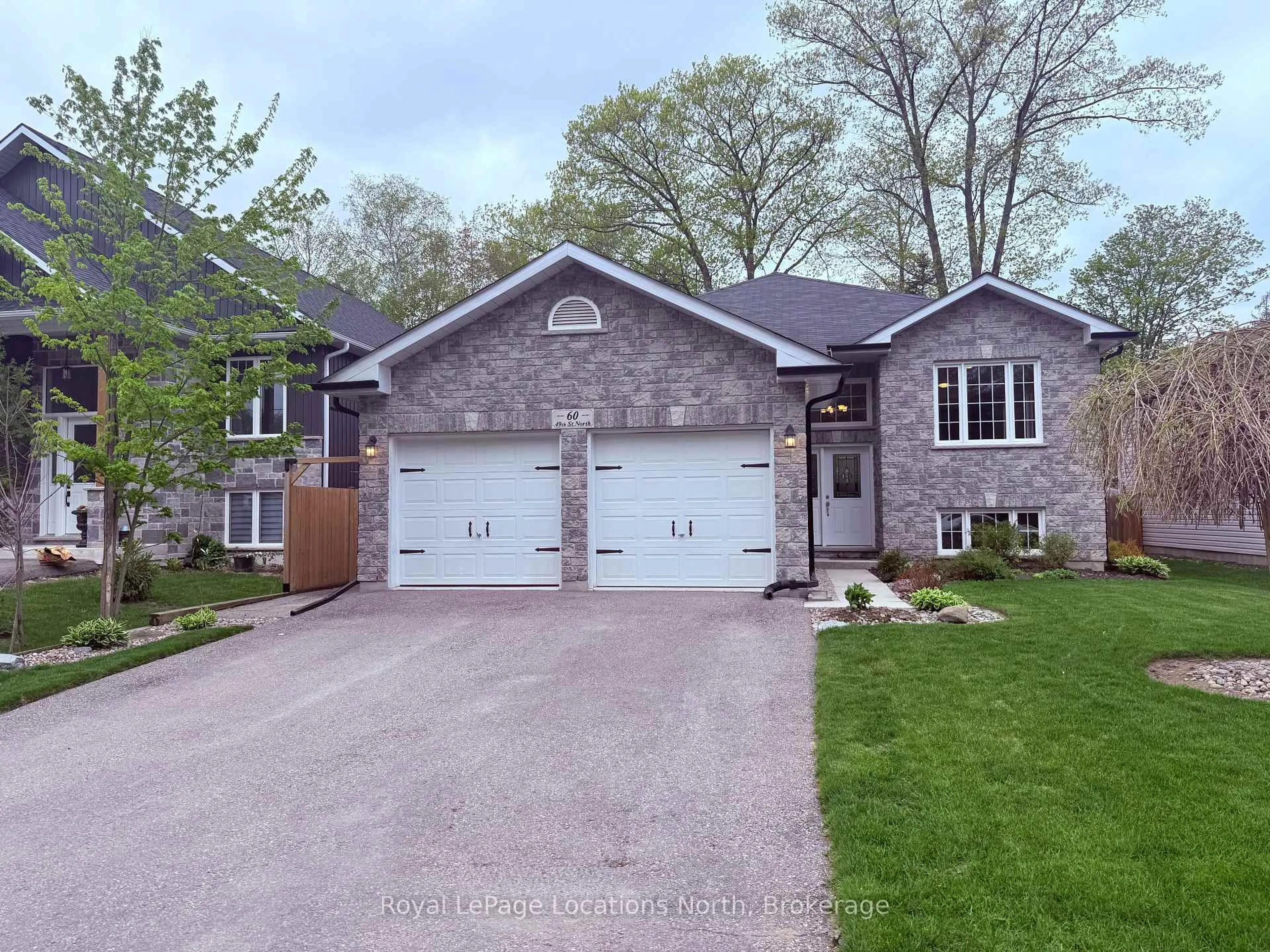 Home with brick exterior material, street for 60 49TH St, Wasaga Beach Ontario L9Z 1Y1