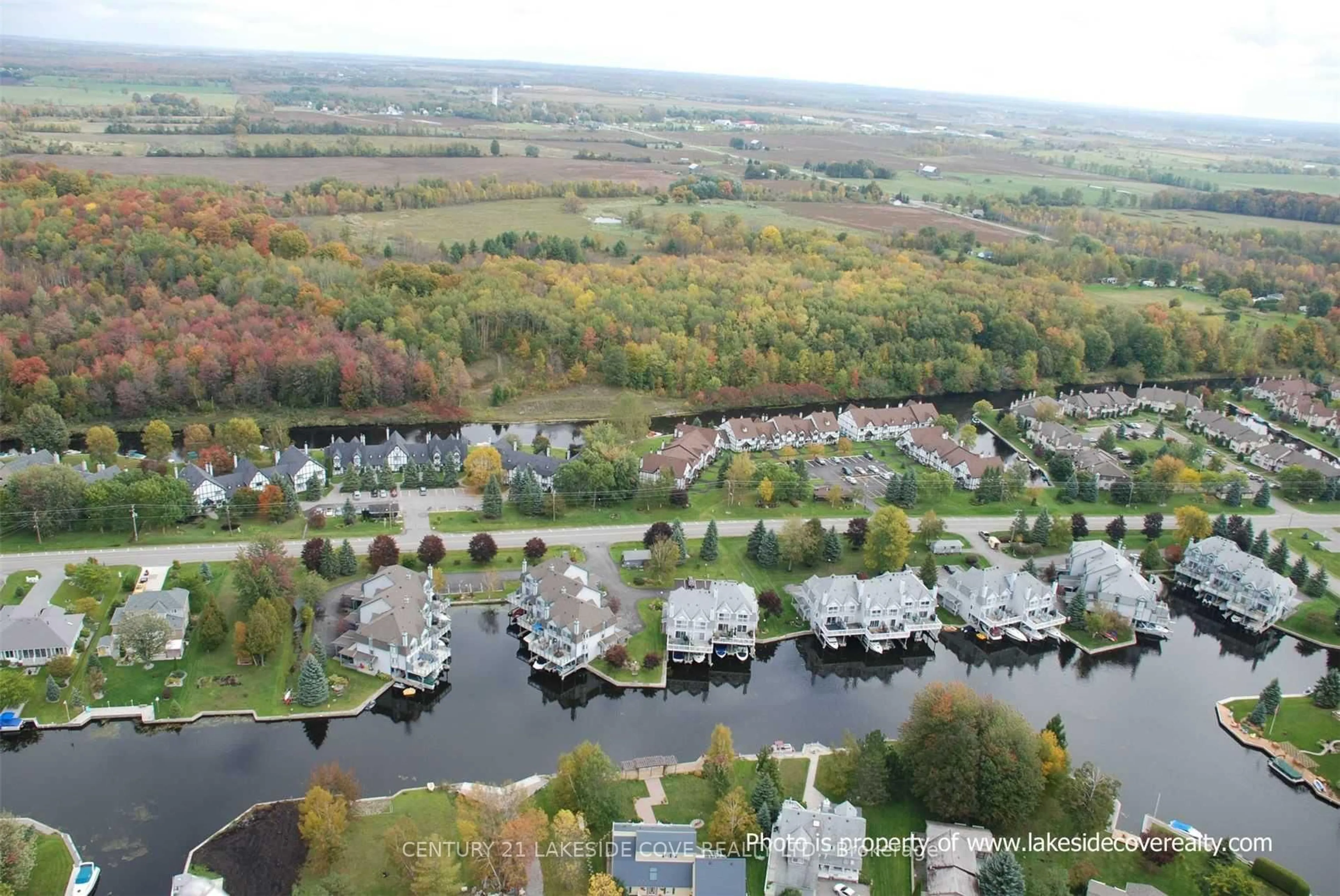 A pic from outside/outdoor area/front of a property/back of a property/a pic from drone, water/lake/river/ocean view for 31 Laguna Pkwy #Unit 13, Ramara Ontario L0K 1B0