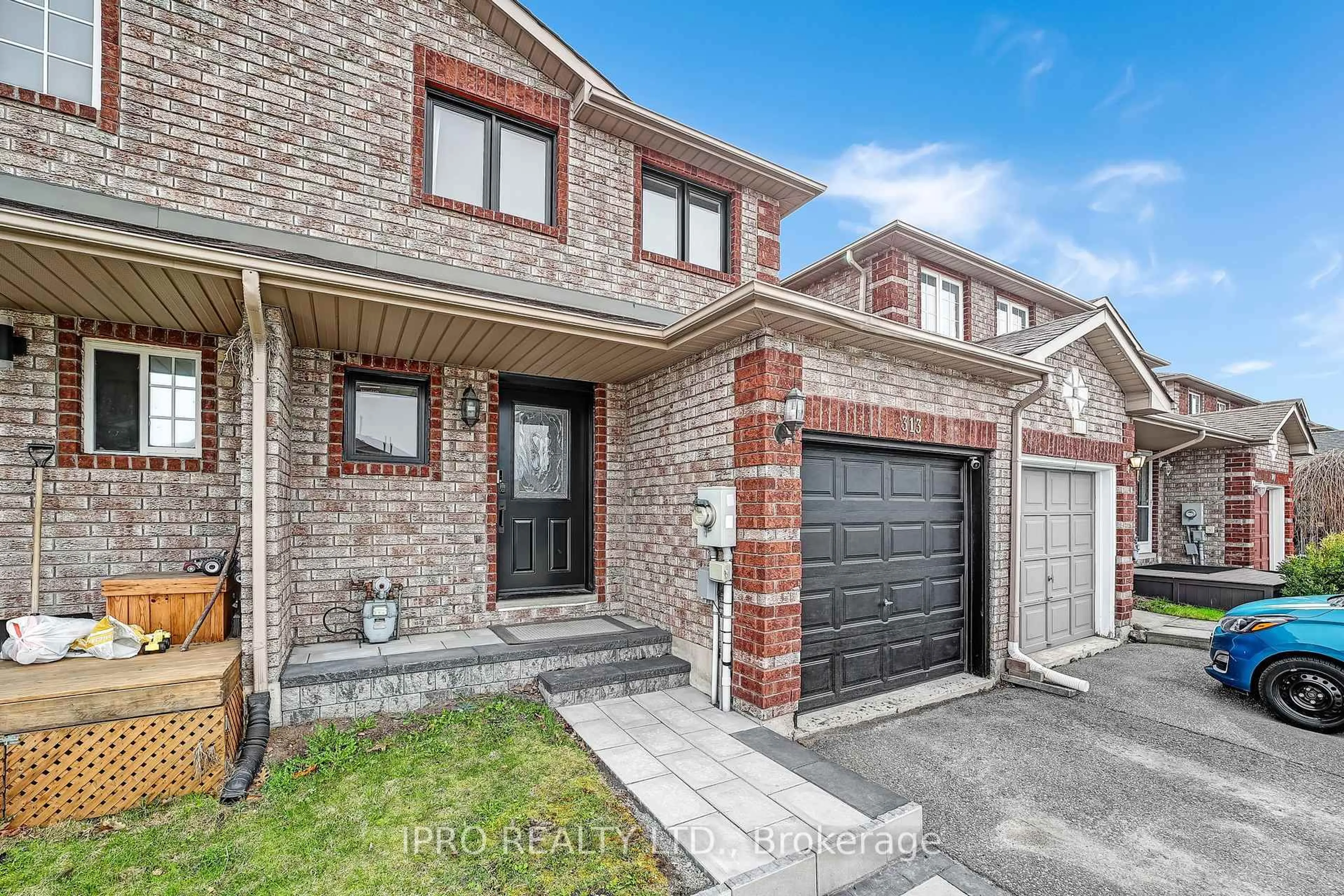 Home with brick exterior material, street for 313 Dunsmore Lane, Barrie Ontario L4M 7A8