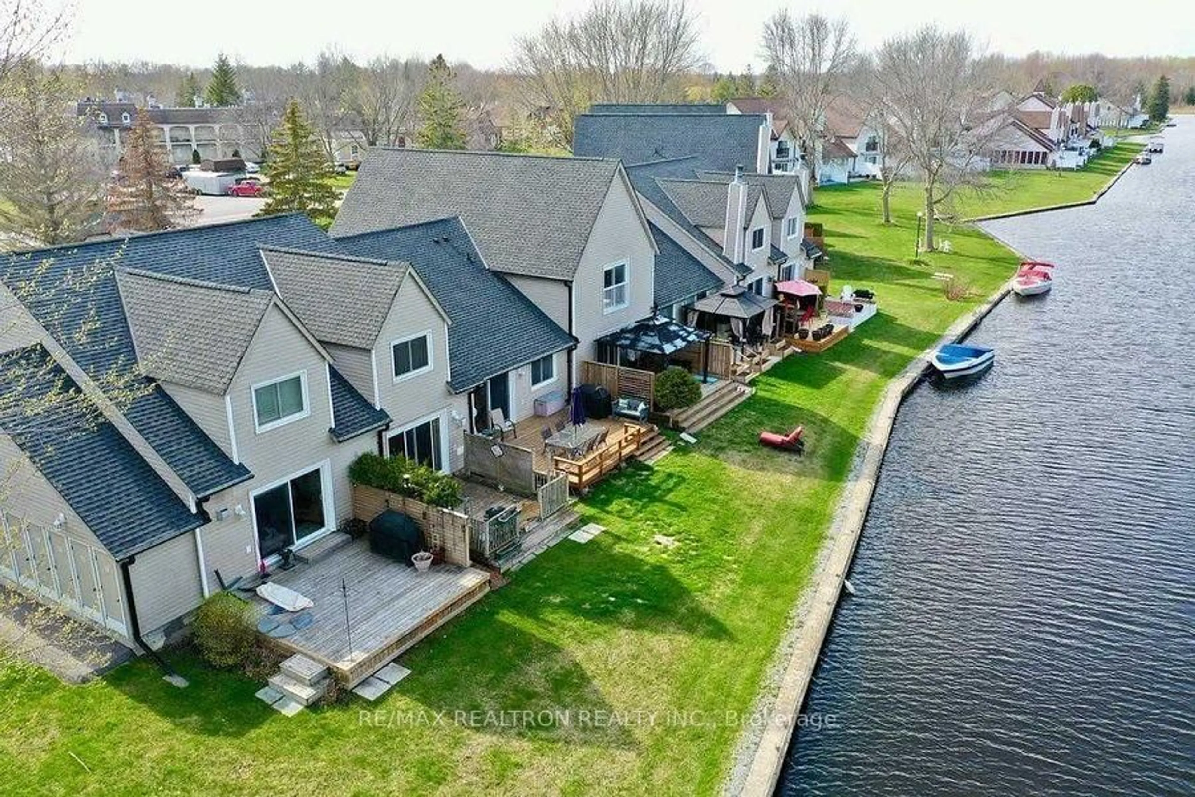 A pic from outside/outdoor area/front of a property/back of a property/a pic from drone, water/lake/river/ocean view for 51 Laguna Pkwy #Unit 16, Ramara Ontario L0K 1B0