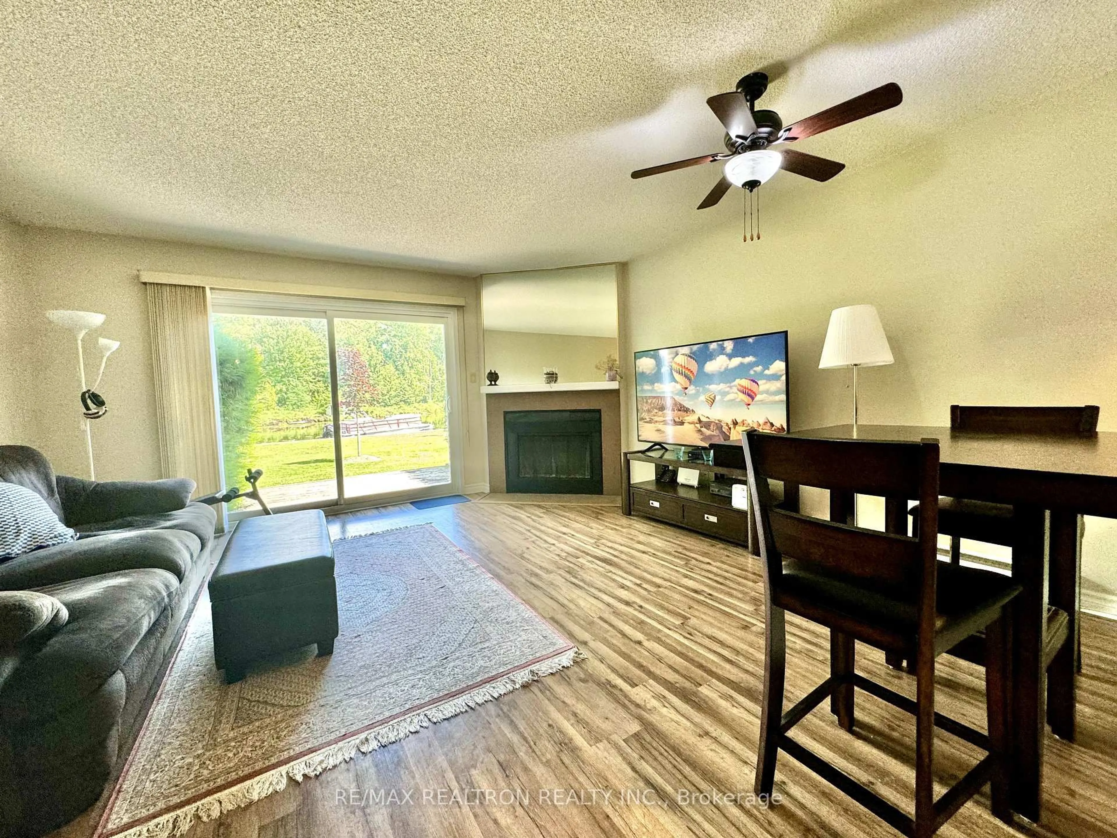Living room with furniture, wood/laminate floor for 51 Laguna Pkwy #Unit 16, Ramara Ontario L0K 1B0
