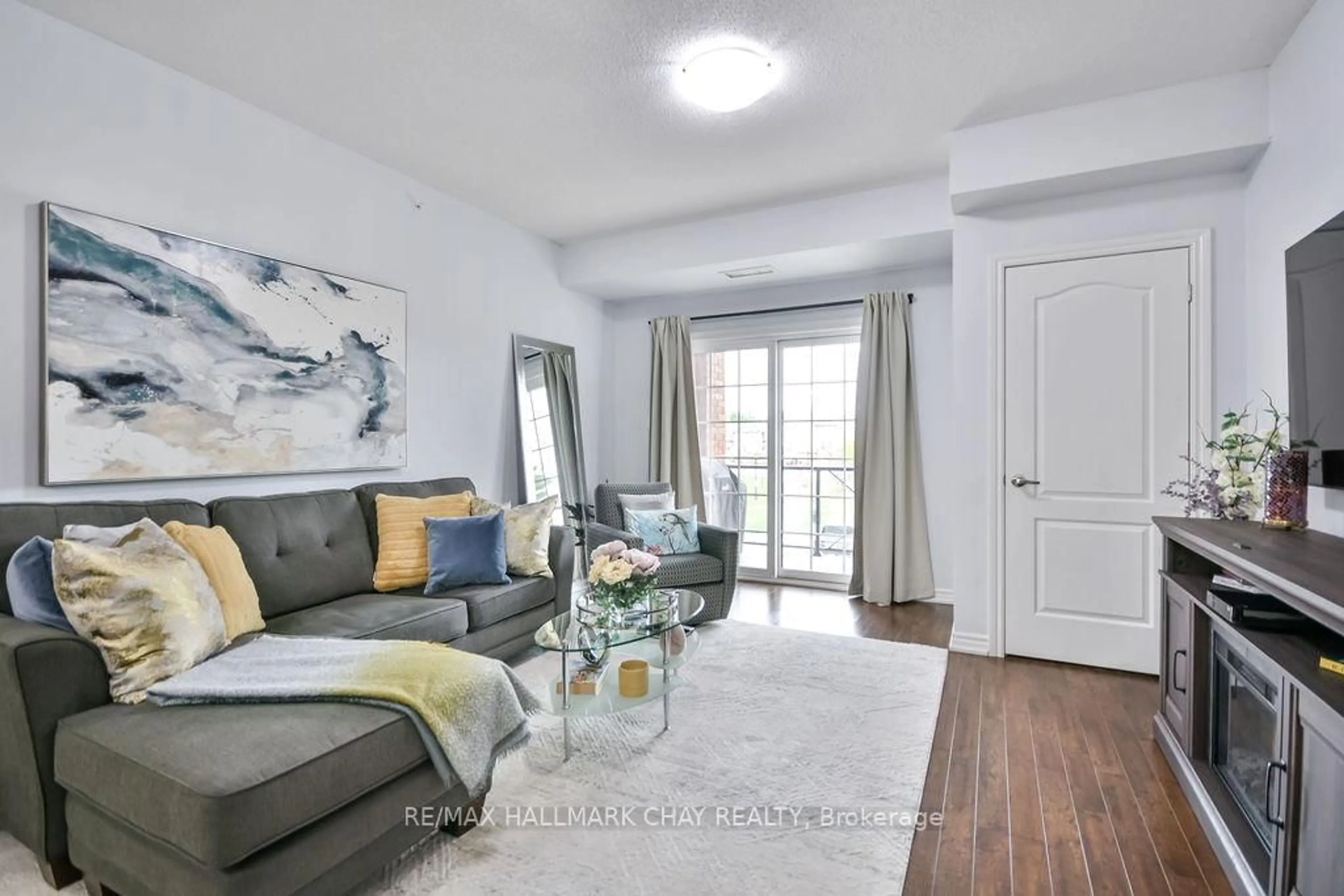 Living room with furniture, unknown for 43 Ferndale Dr #207, Barrie Ontario L4N 5W6