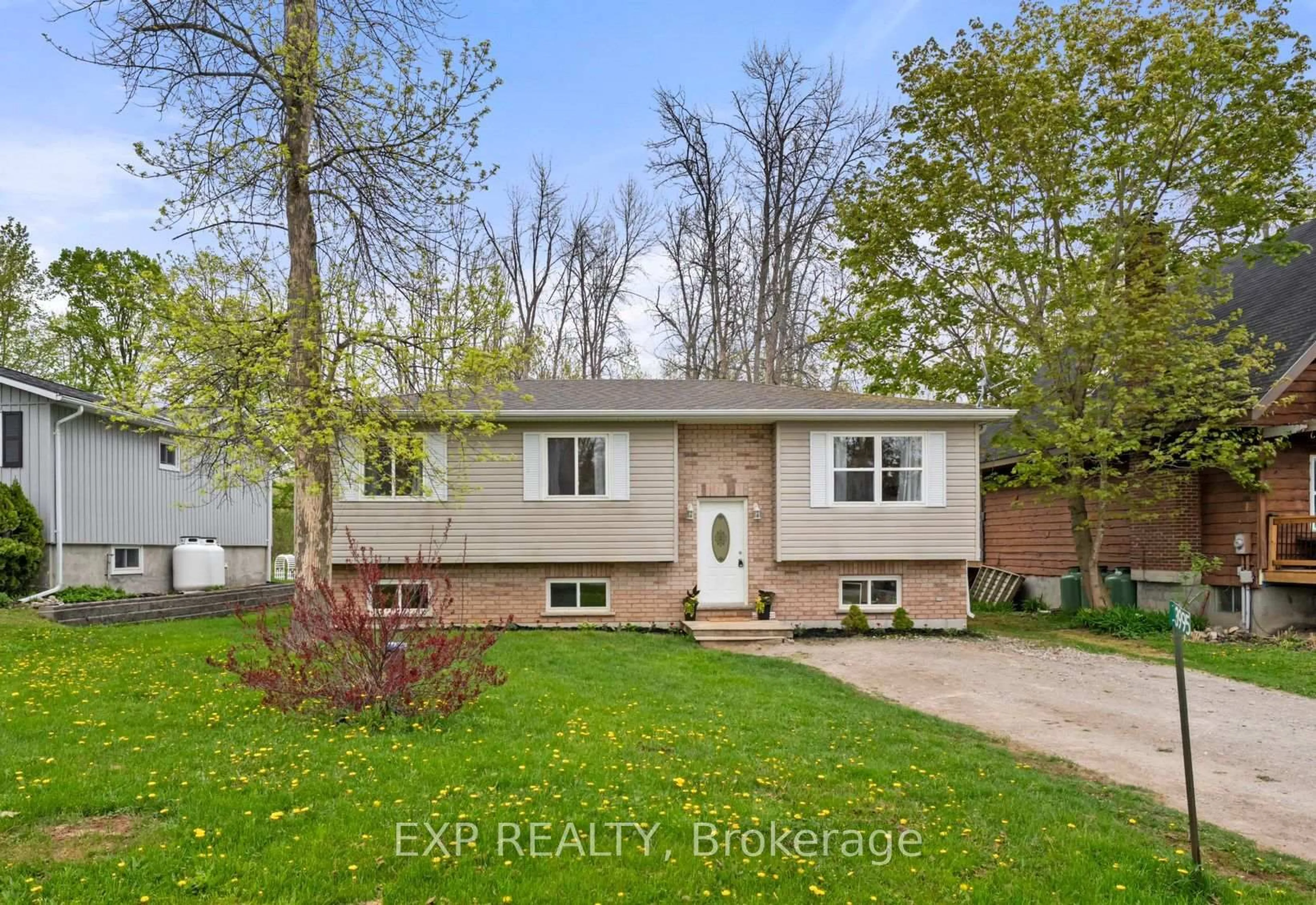Home with vinyl exterior material, street for 3995 Woodland Dr, Ramara Ontario L3V 0S2