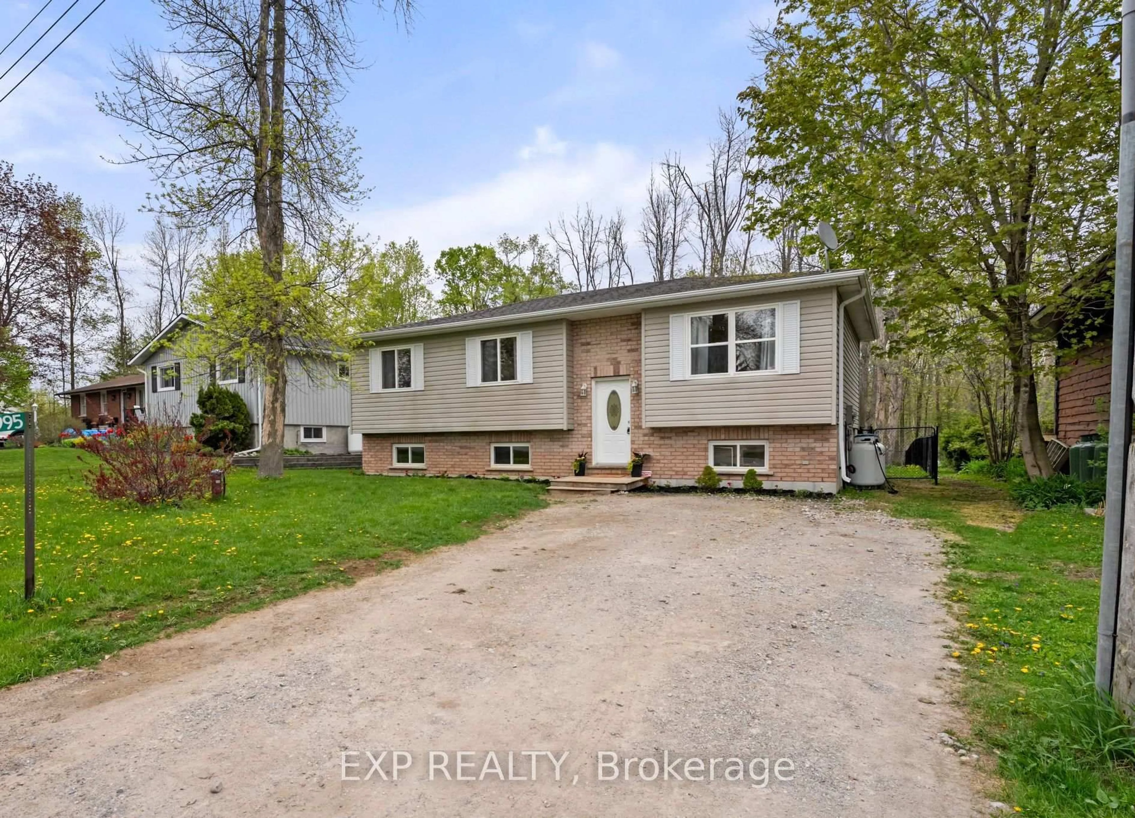 A pic from outside/outdoor area/front of a property/back of a property/a pic from drone, street for 3995 Woodland Dr, Ramara Ontario L3V 0S2