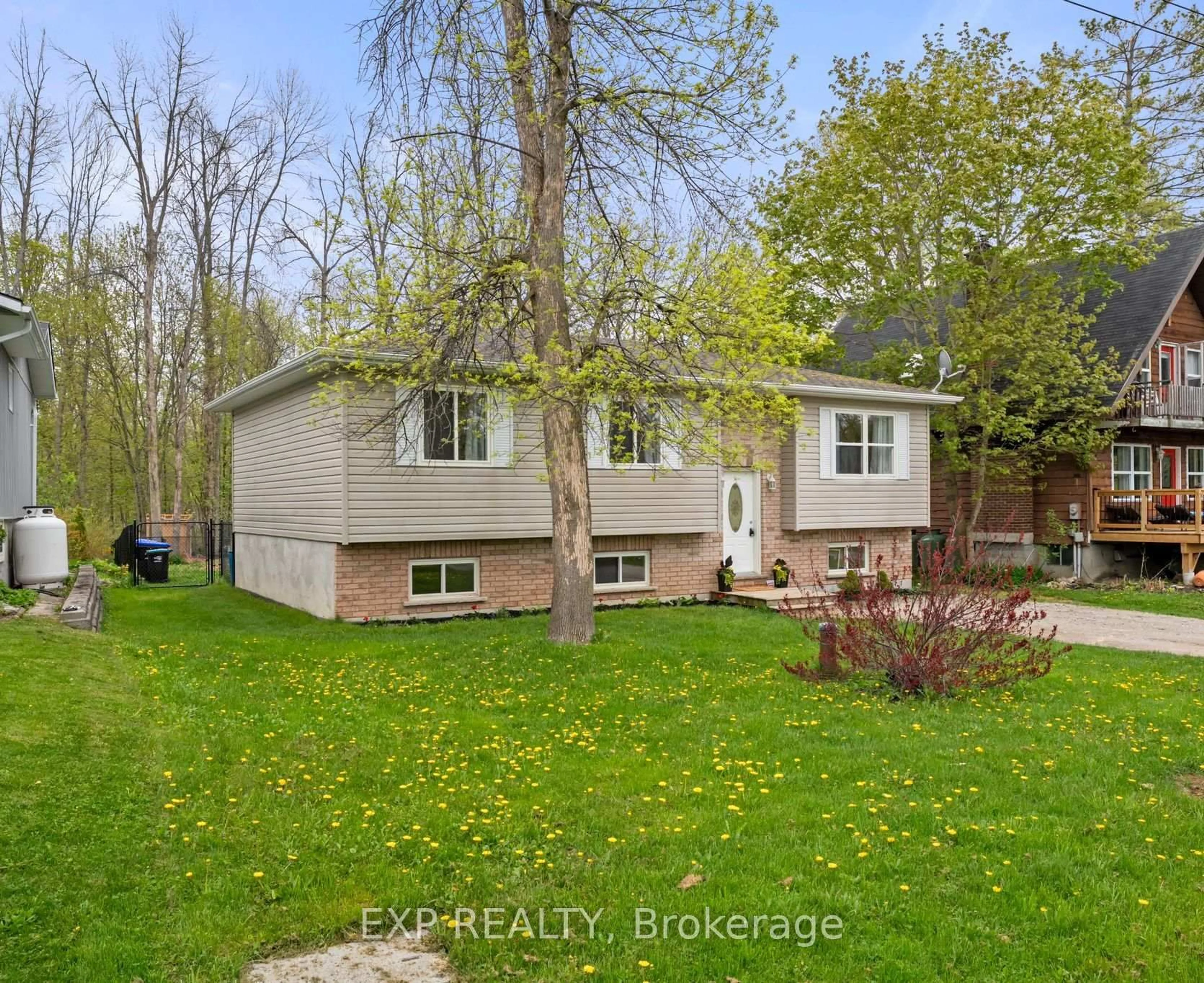 A pic from outside/outdoor area/front of a property/back of a property/a pic from drone, street for 3995 Woodland Dr, Ramara Ontario L3V 0S2