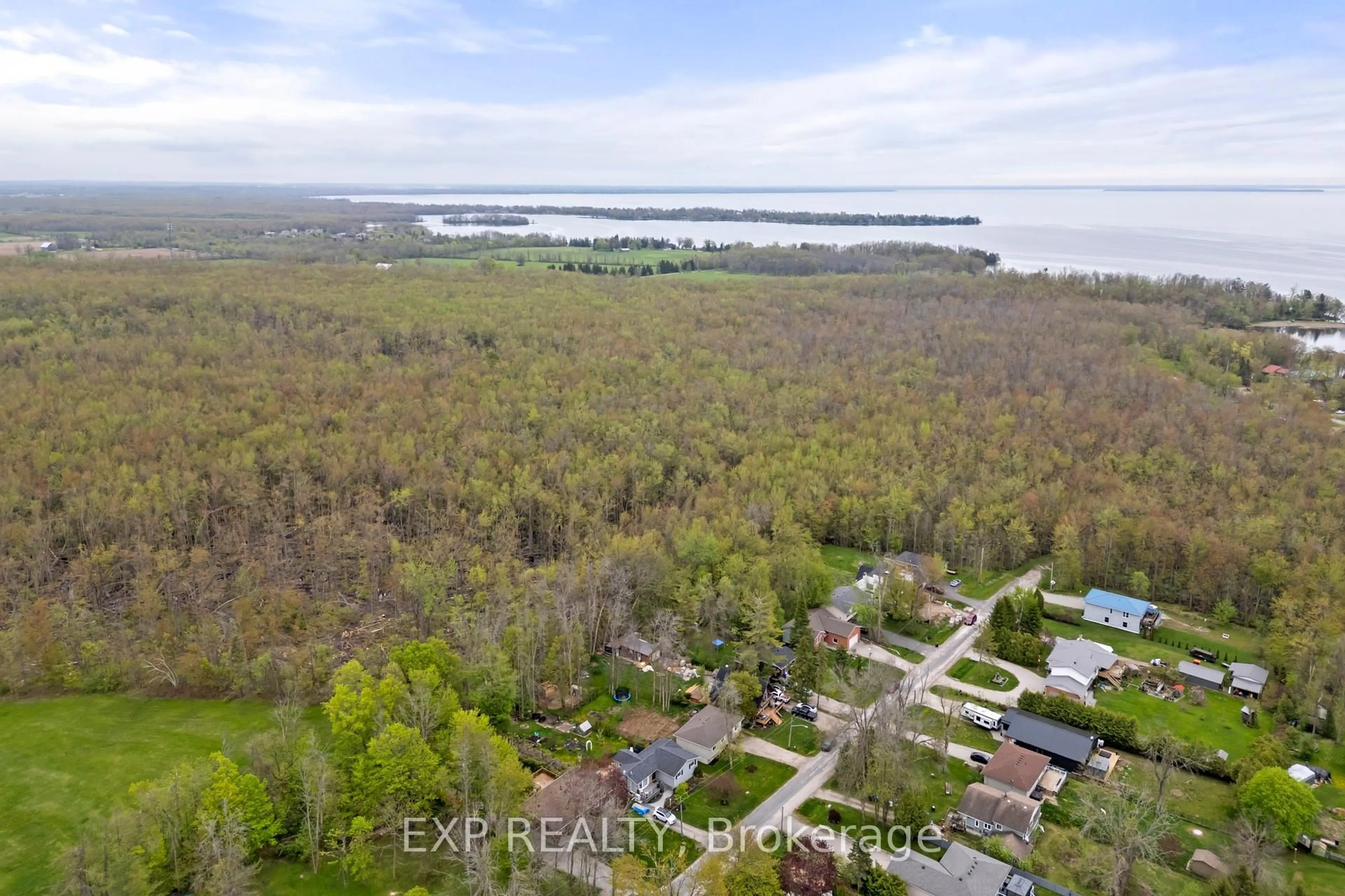 A pic from outside/outdoor area/front of a property/back of a property/a pic from drone, water/lake/river/ocean view for 3995 Woodland Dr, Ramara Ontario L3V 0S2