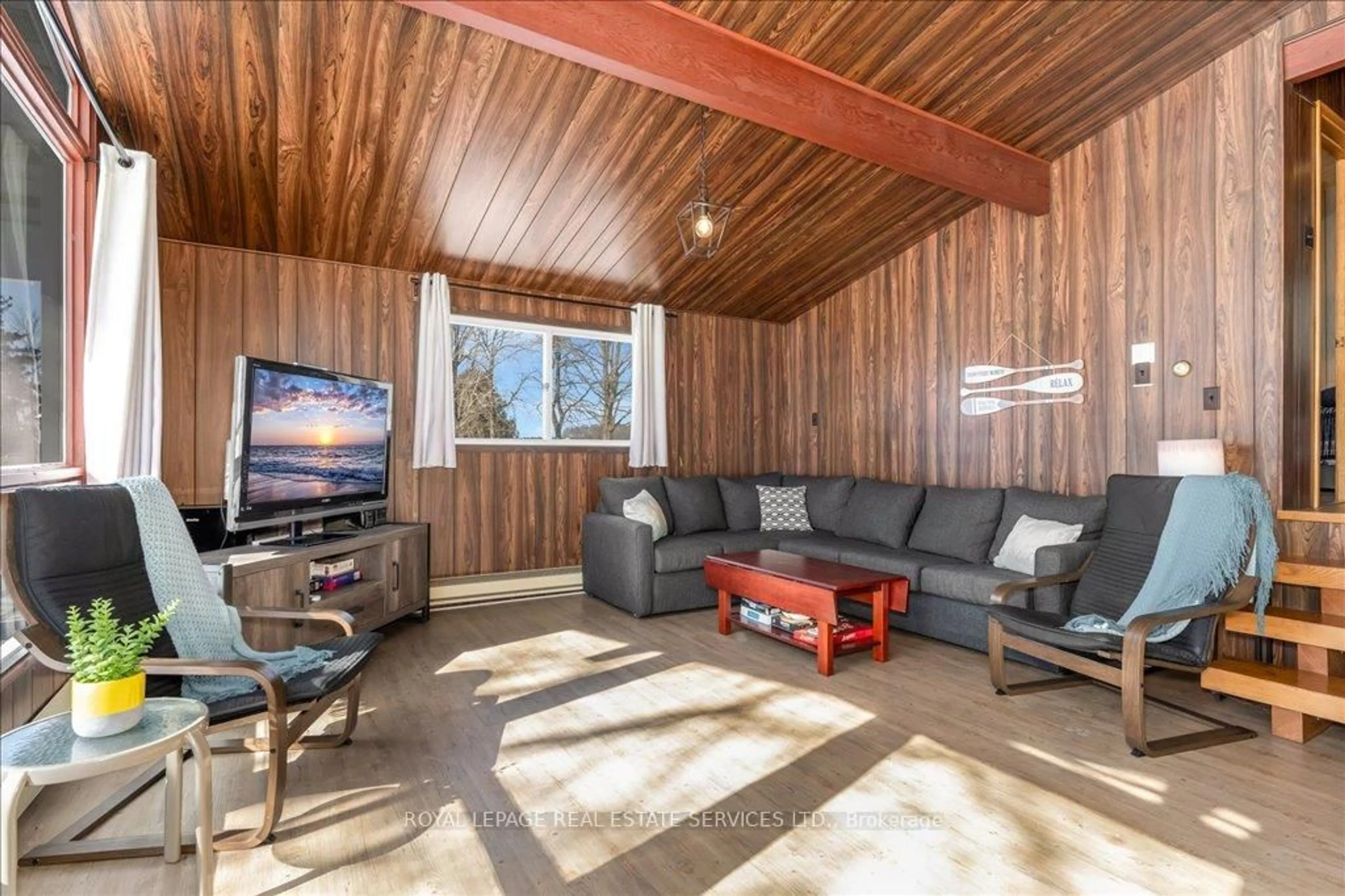 Living room with furniture, wood/laminate floor for 1129 Concession Road 9, Ramara Ontario L0K 1B0