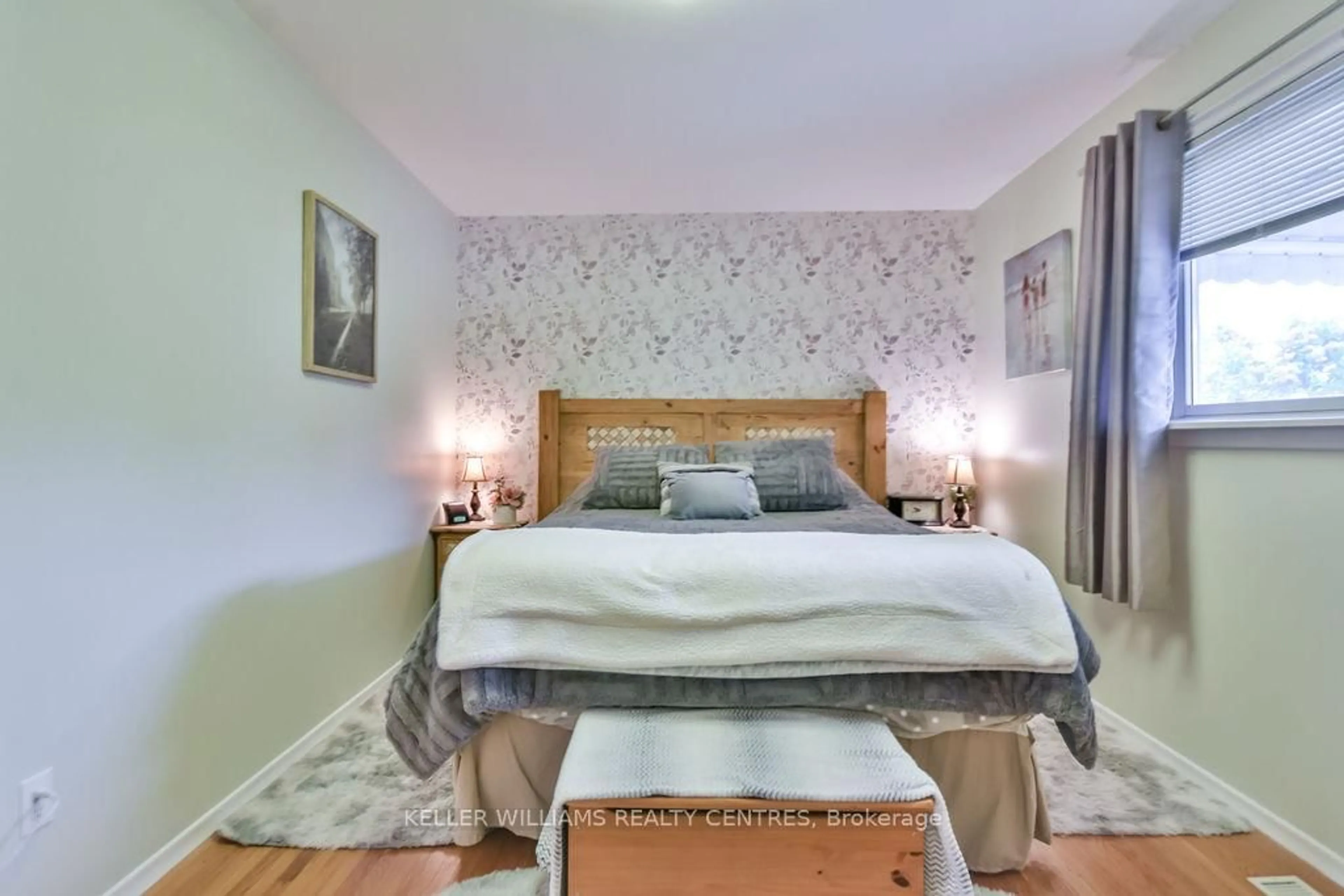 Bedroom with bed, wood/laminate floor for 658 Manly St, Midland Ontario L4R 3G5