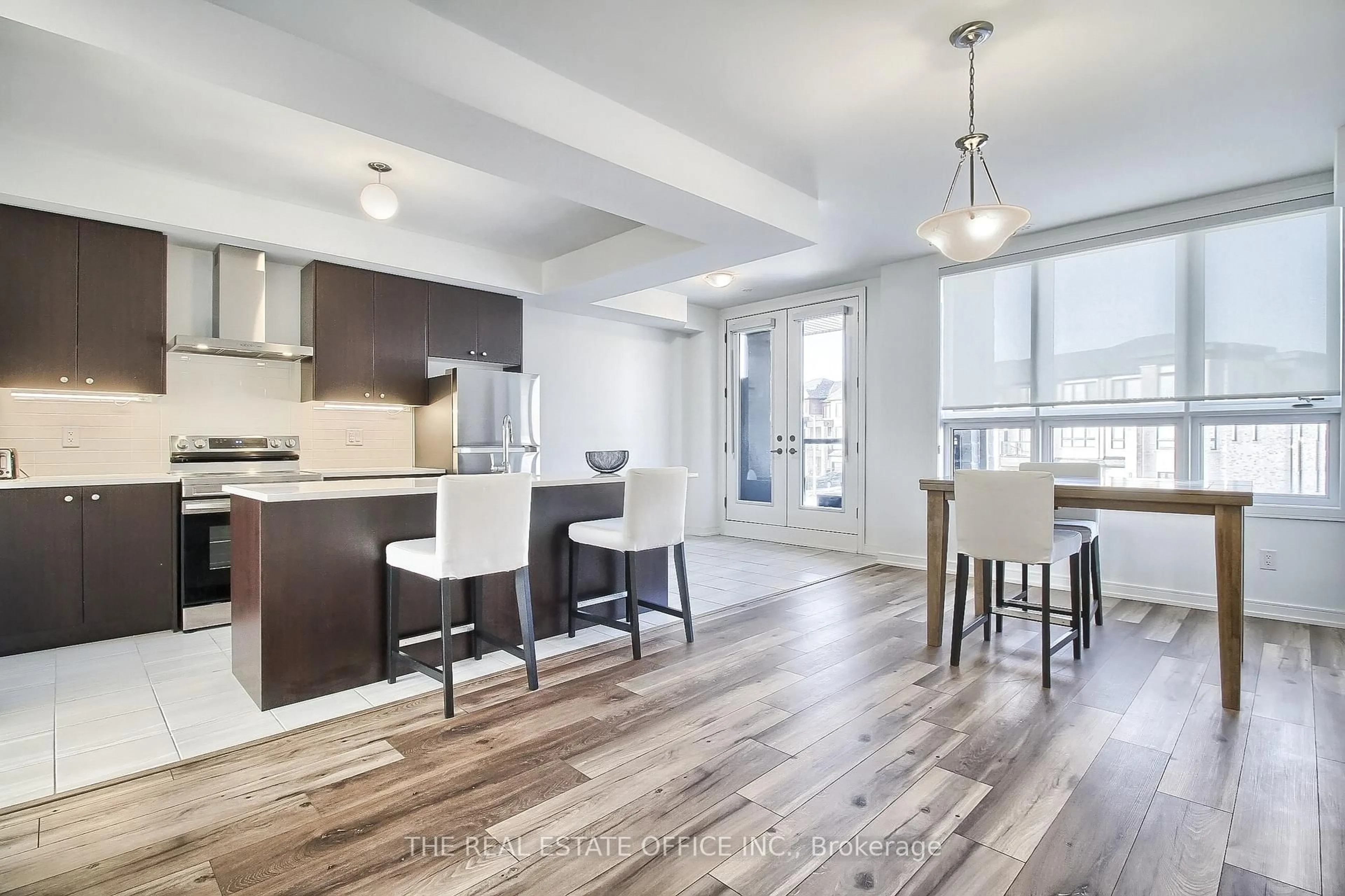 Open concept kitchen, wood/laminate floor for 40 Blue forest Cres, Barrie Ontario L9J 0N3