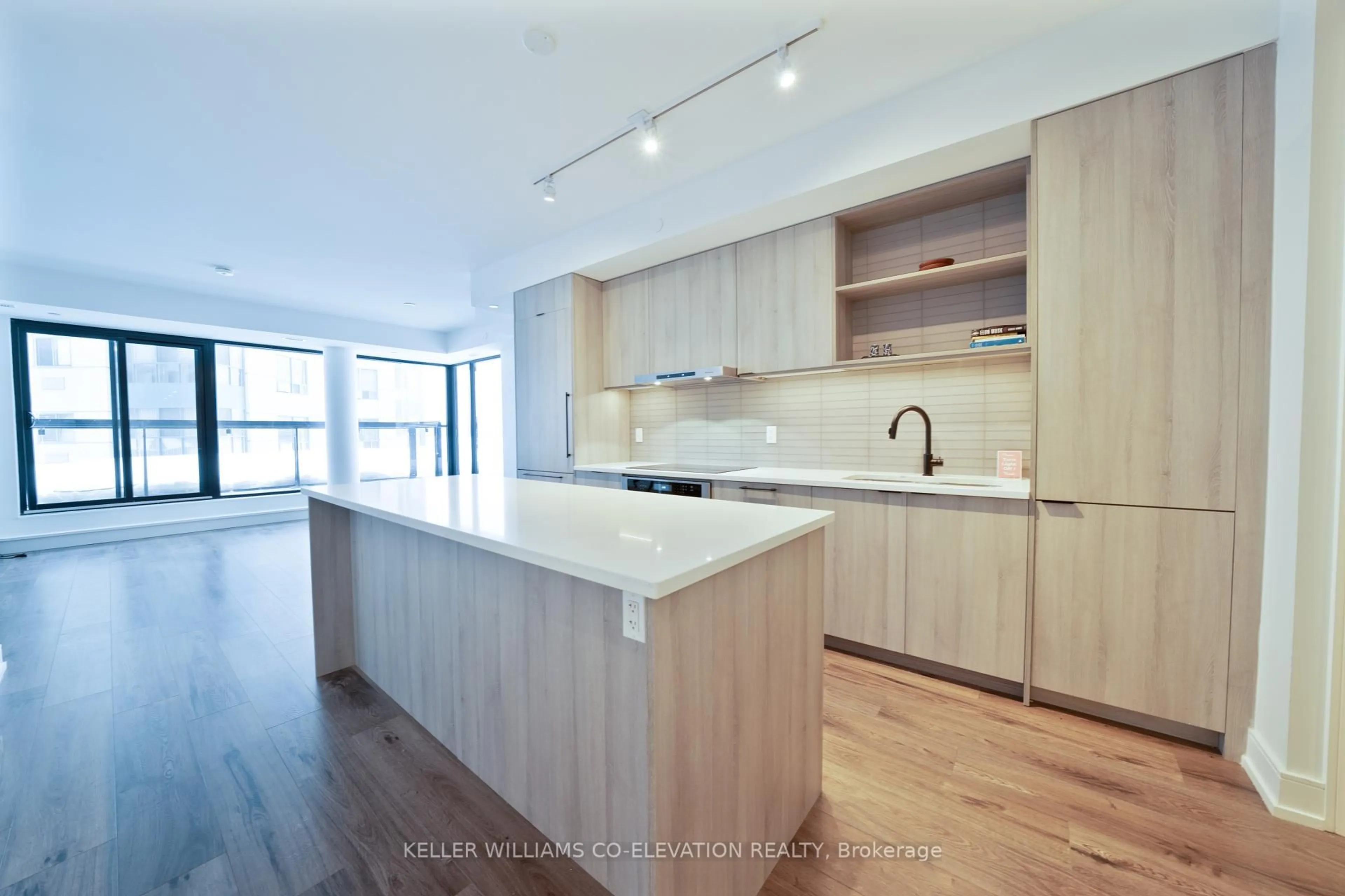 Open concept kitchen, wood/laminate floor for 185 Dunlop St #414, Barrie Ontario L4M 1B2