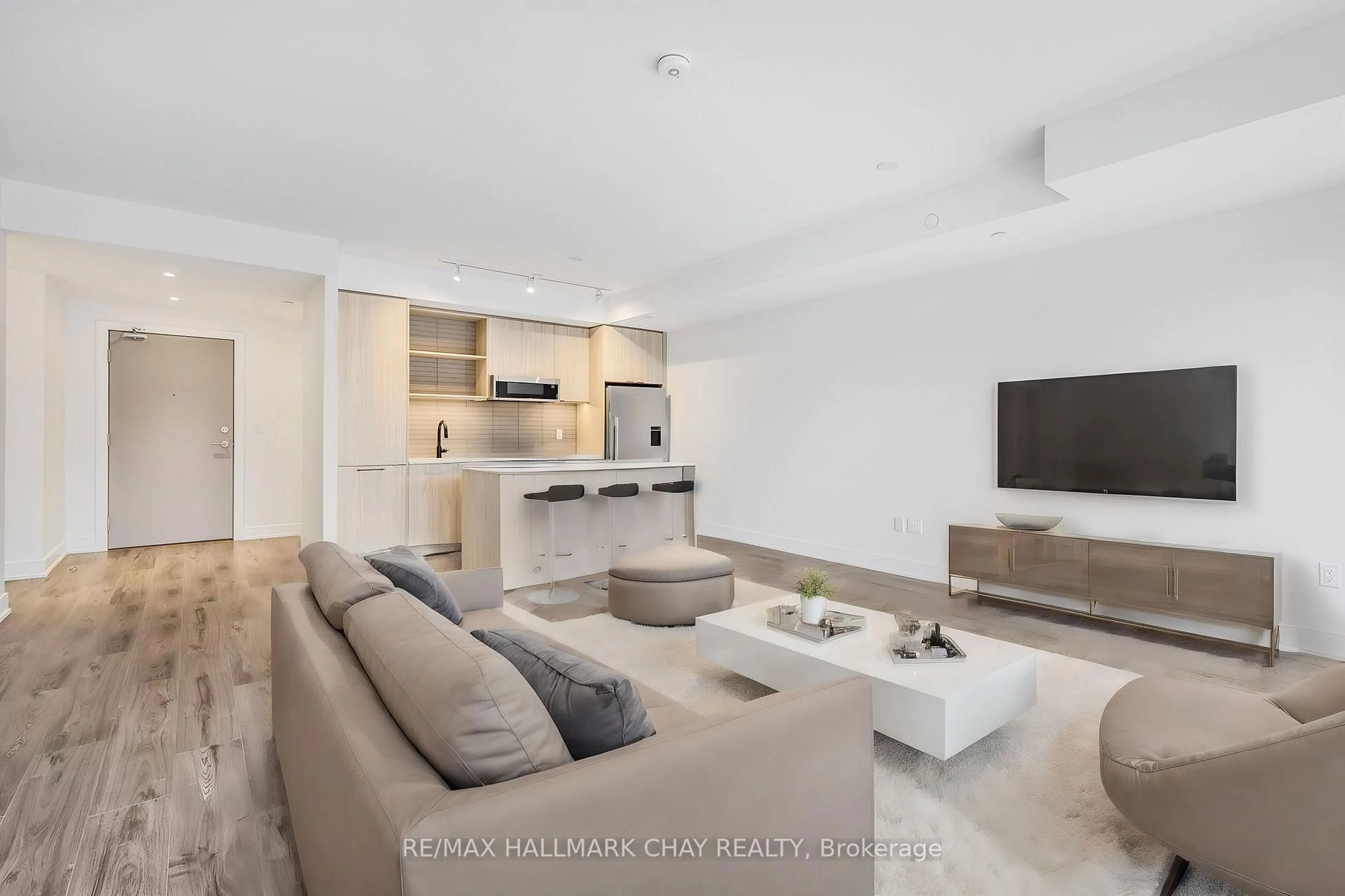 Living room with furniture, unknown for 185 Dunlop St #521, Barrie Ontario L4M 1B2