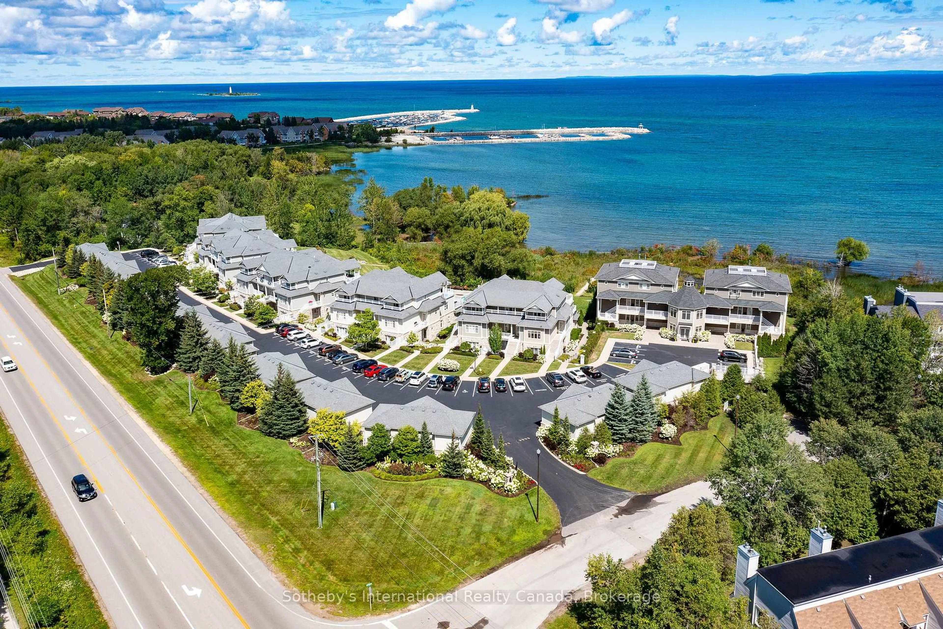 A pic from outside/outdoor area/front of a property/back of a property/a pic from drone, water/lake/river/ocean view for 40 TROTT Blvd #504, Collingwood Ontario L9Y 5K5