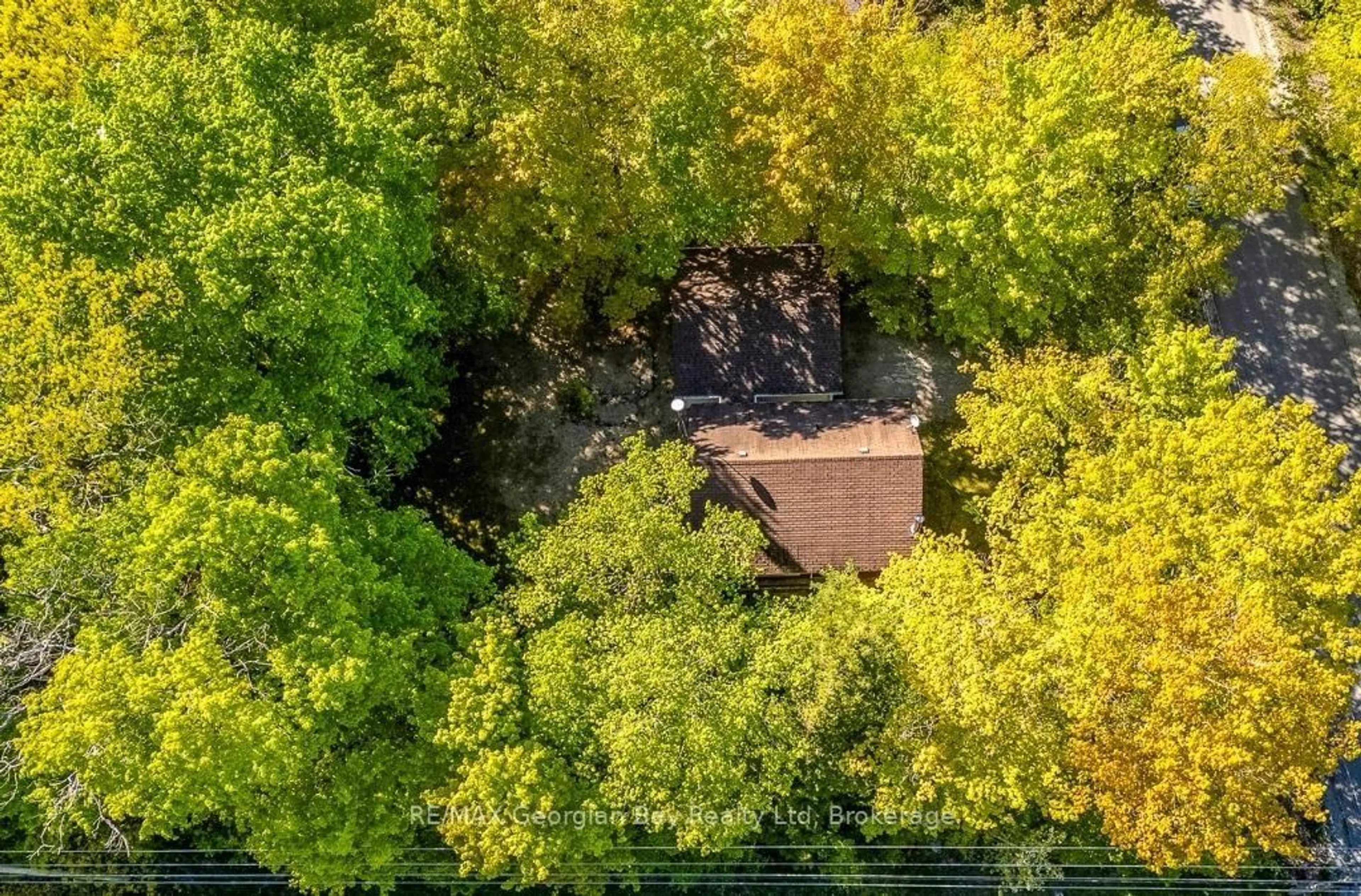 A pic from outside/outdoor area/front of a property/back of a property/a pic from drone, forest/trees view for 2 Manitou Cres, Tiny Ontario L9M 0C6