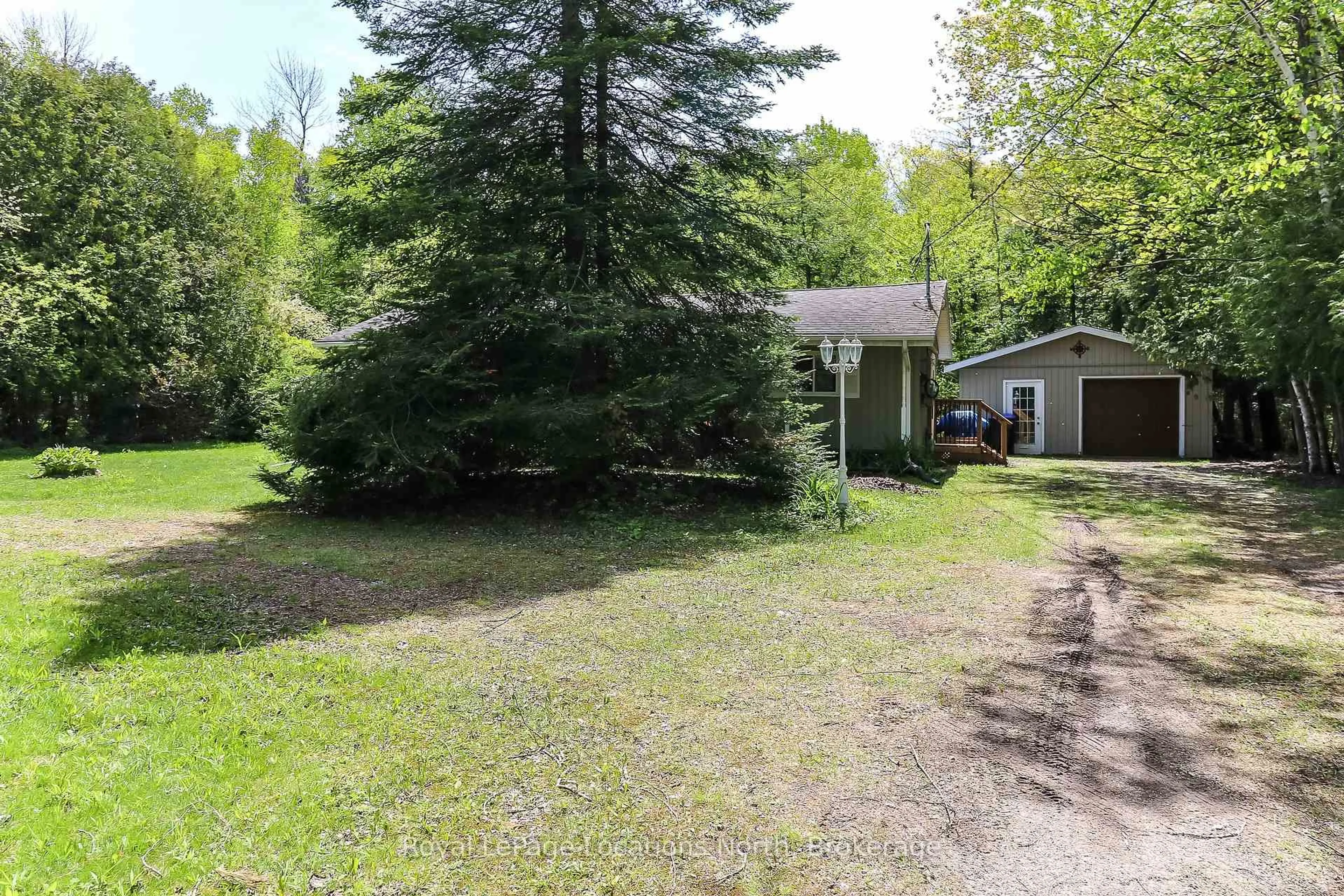 A pic from outside/outdoor area/front of a property/back of a property/a pic from drone, forest/trees view for 2198 Champlain Rd, Tiny Ontario L9M 0C4