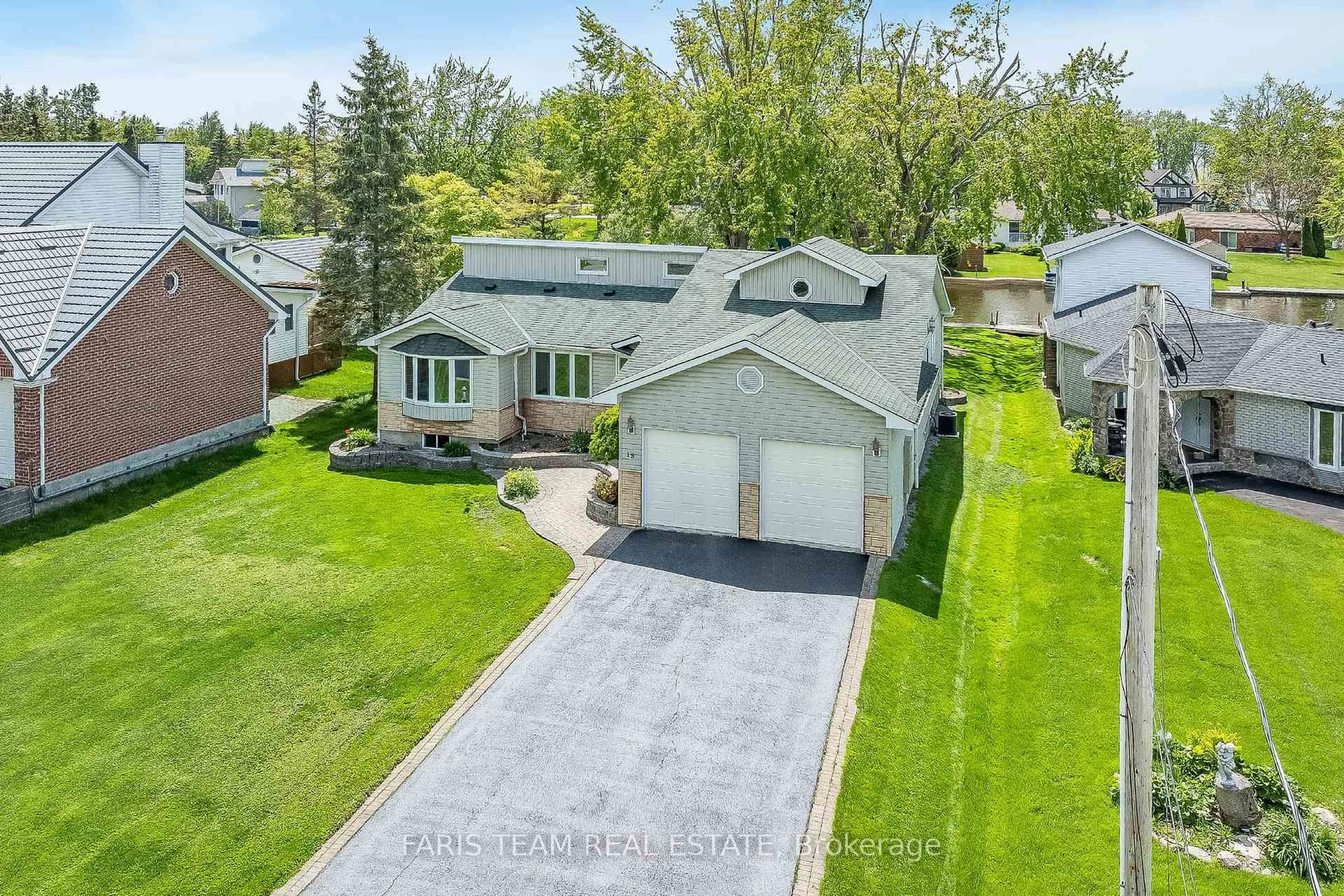 A pic from outside/outdoor area/front of a property/back of a property/a pic from drone, street for 18 Turtle Path, Ramara Ontario L0K 2B0