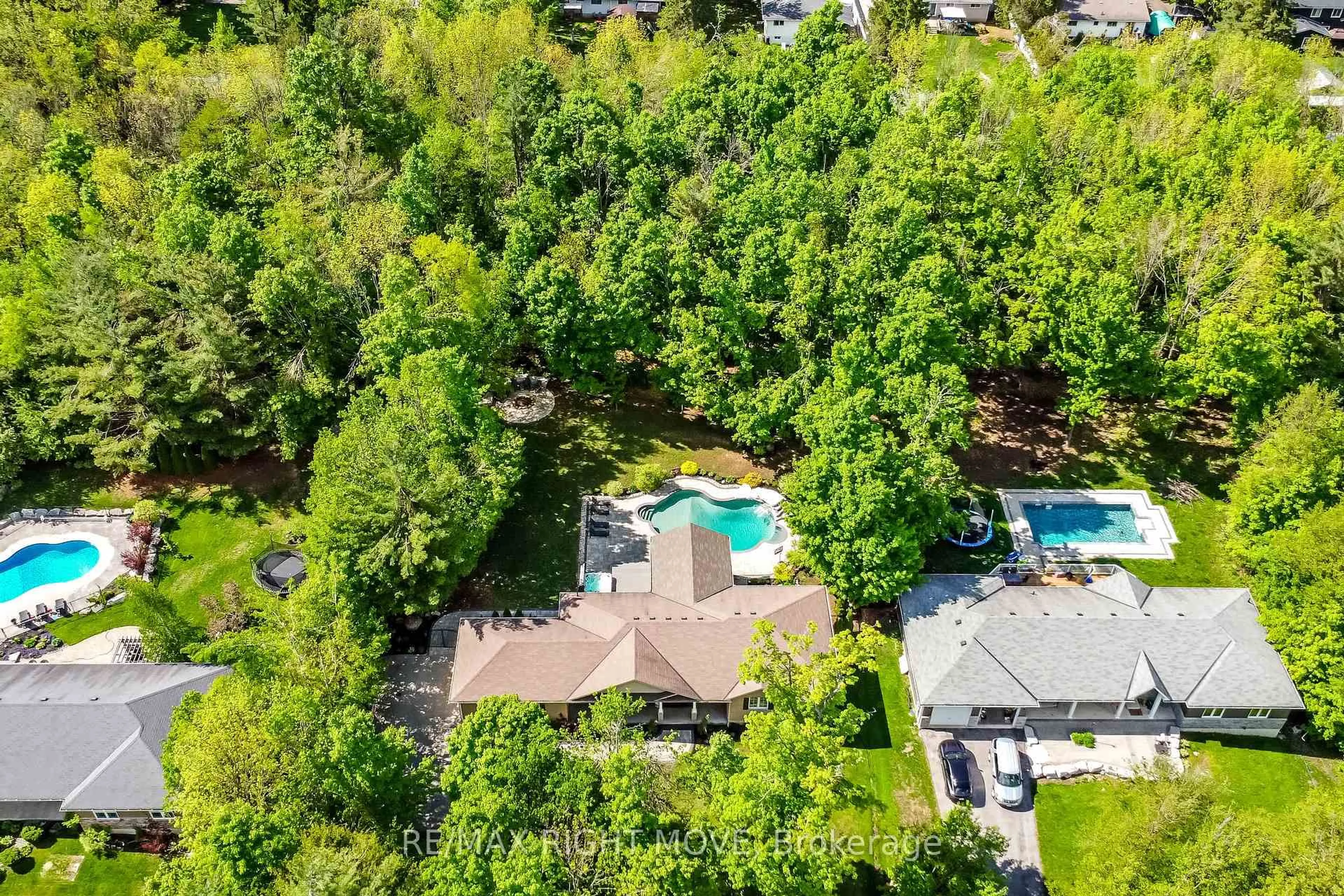A pic from outside/outdoor area/front of a property/back of a property/a pic from drone, forest/trees view for 10 Merrington Ave, Oro-Medonte Ontario L3V 0R5