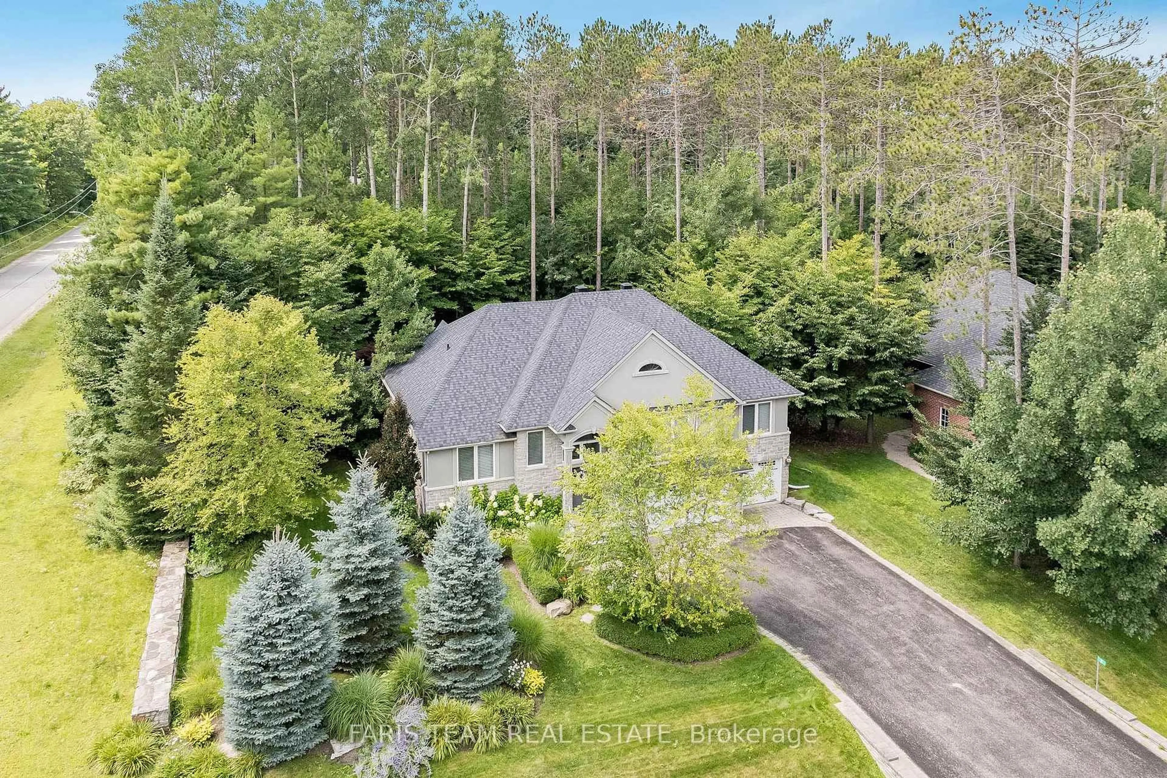 A pic from outside/outdoor area/front of a property/back of a property/a pic from drone, forest/trees view for 2 Reillys Run, Springwater Ontario L0L 1Y3