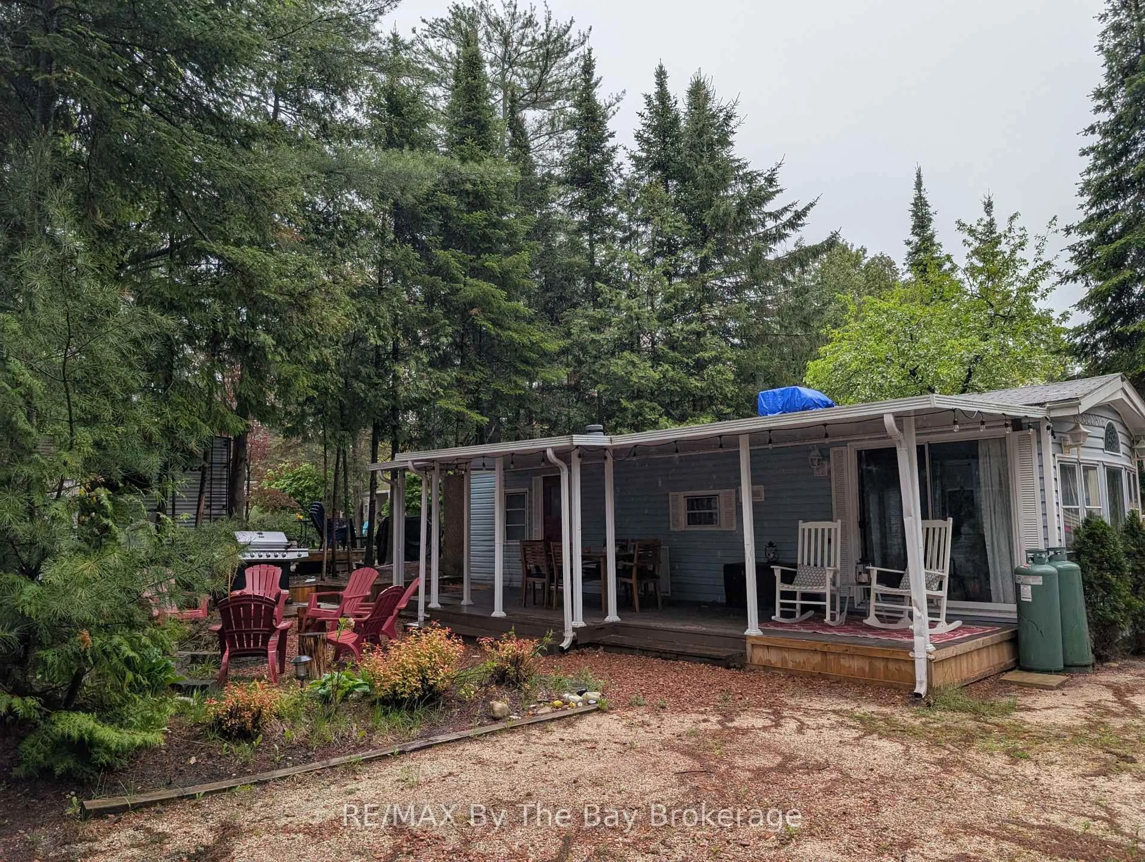 Patio, forest/trees view for 85 Theme Park Dr #210, Wasaga Beach Ontario L9Z 1X7