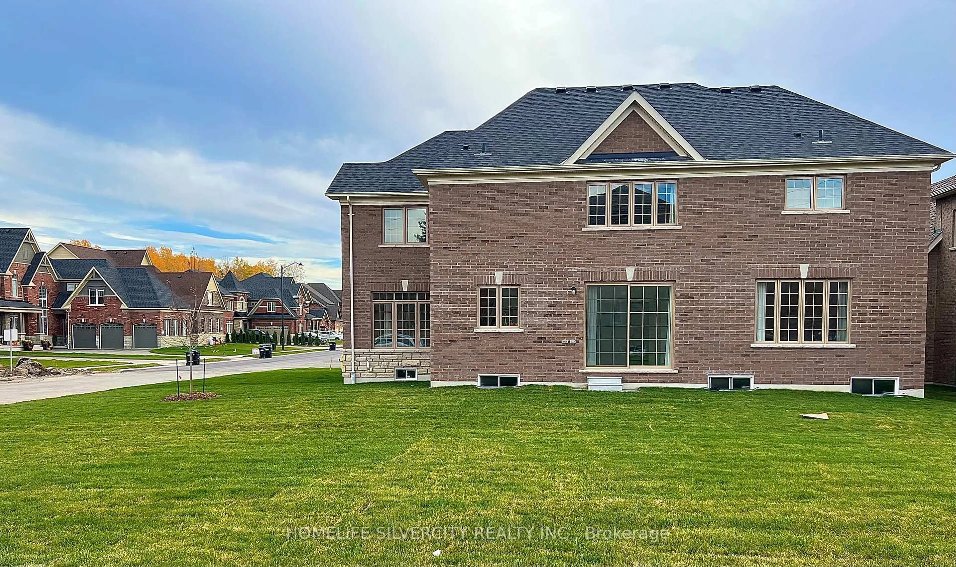 Home with brick exterior material, street for 115 Rugman Cres, Springwater Ontario L9X 2A5