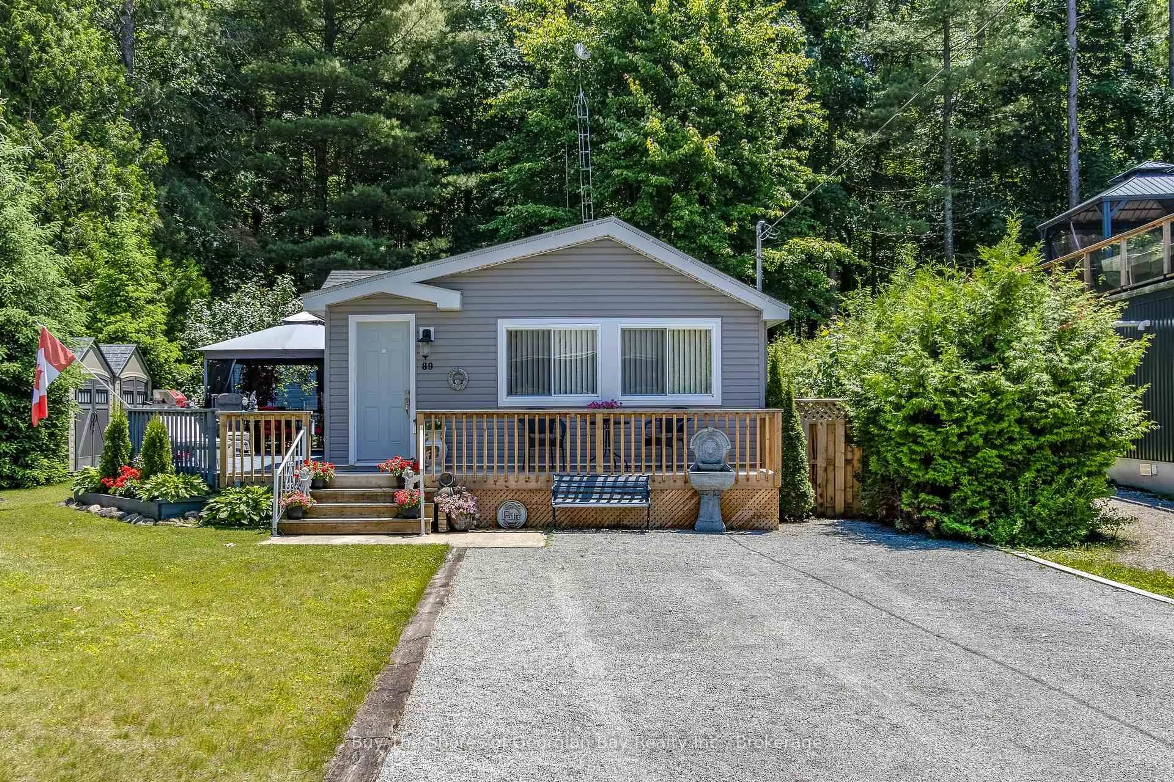 Home with vinyl exterior material, street for 89 Andrew Dr, Tiny Ontario L9M 0B4