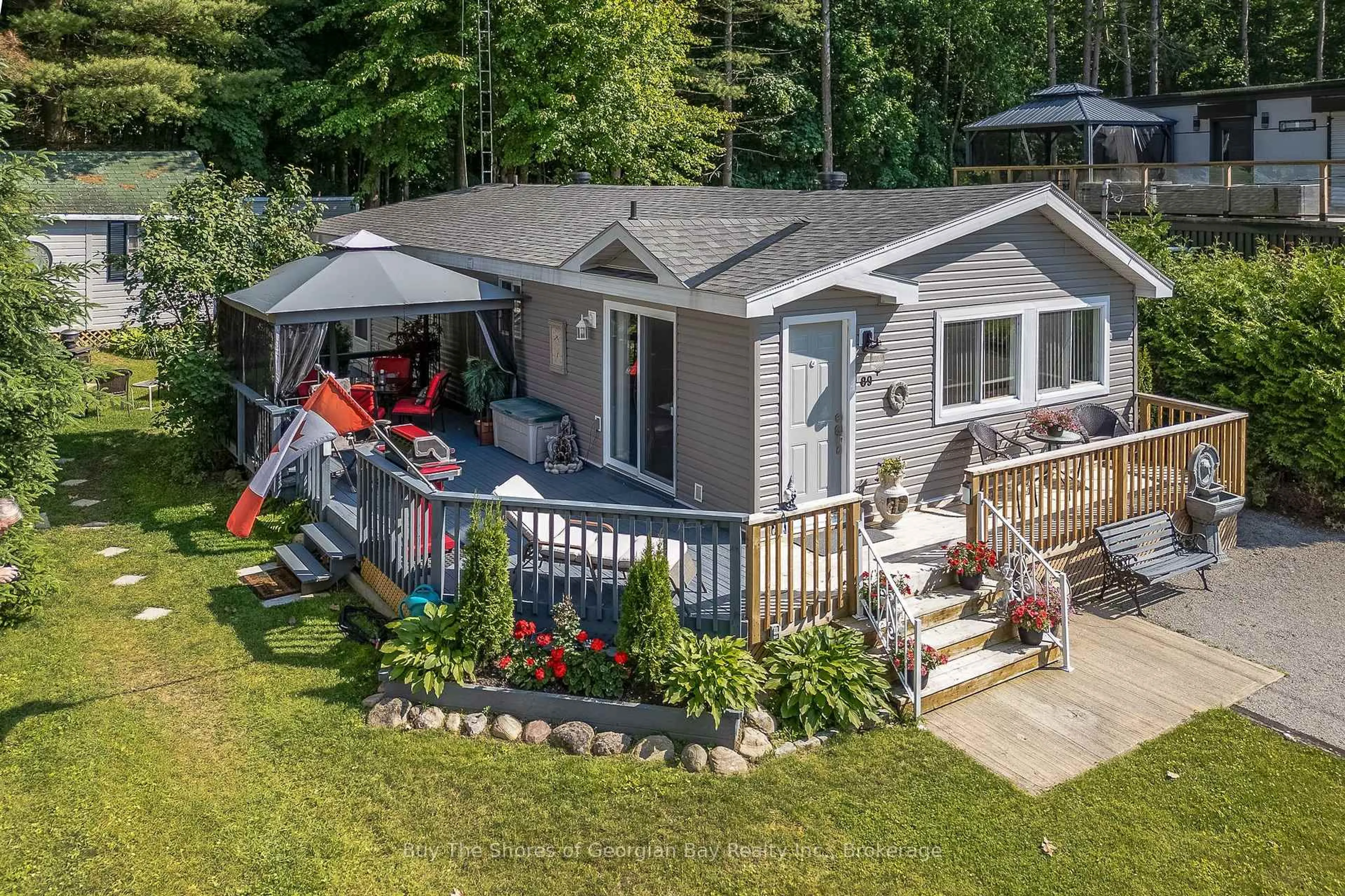 A pic from outside/outdoor area/front of a property/back of a property/a pic from drone, water/lake/river/ocean view for 89 Andrew Dr, Tiny Ontario L9M 0B4