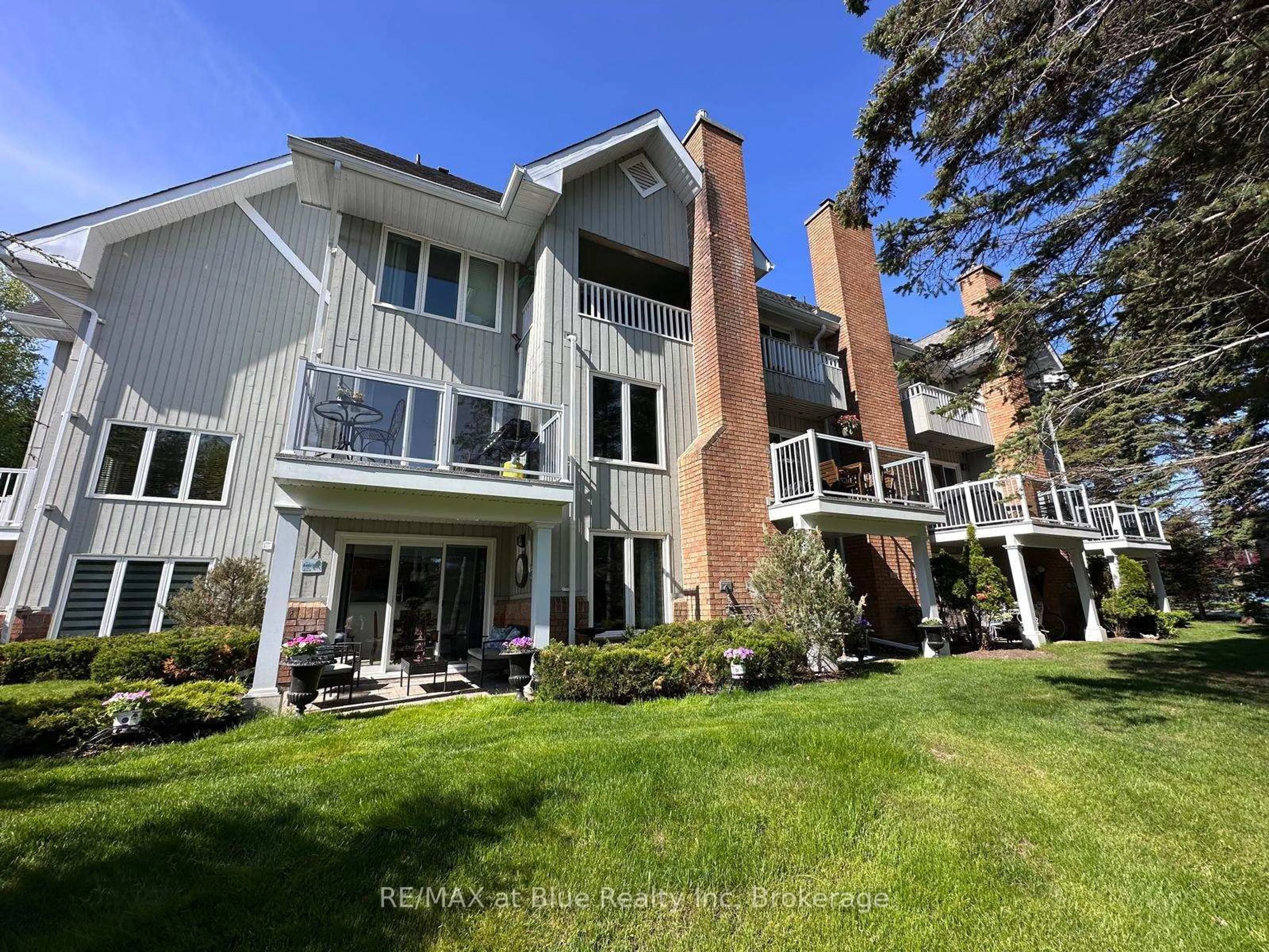 A pic from outside/outdoor area/front of a property/back of a property/a pic from drone, water/lake/river/ocean view for 30 RAMBLINGS Way #144, Collingwood Ontario L9Y 5C8