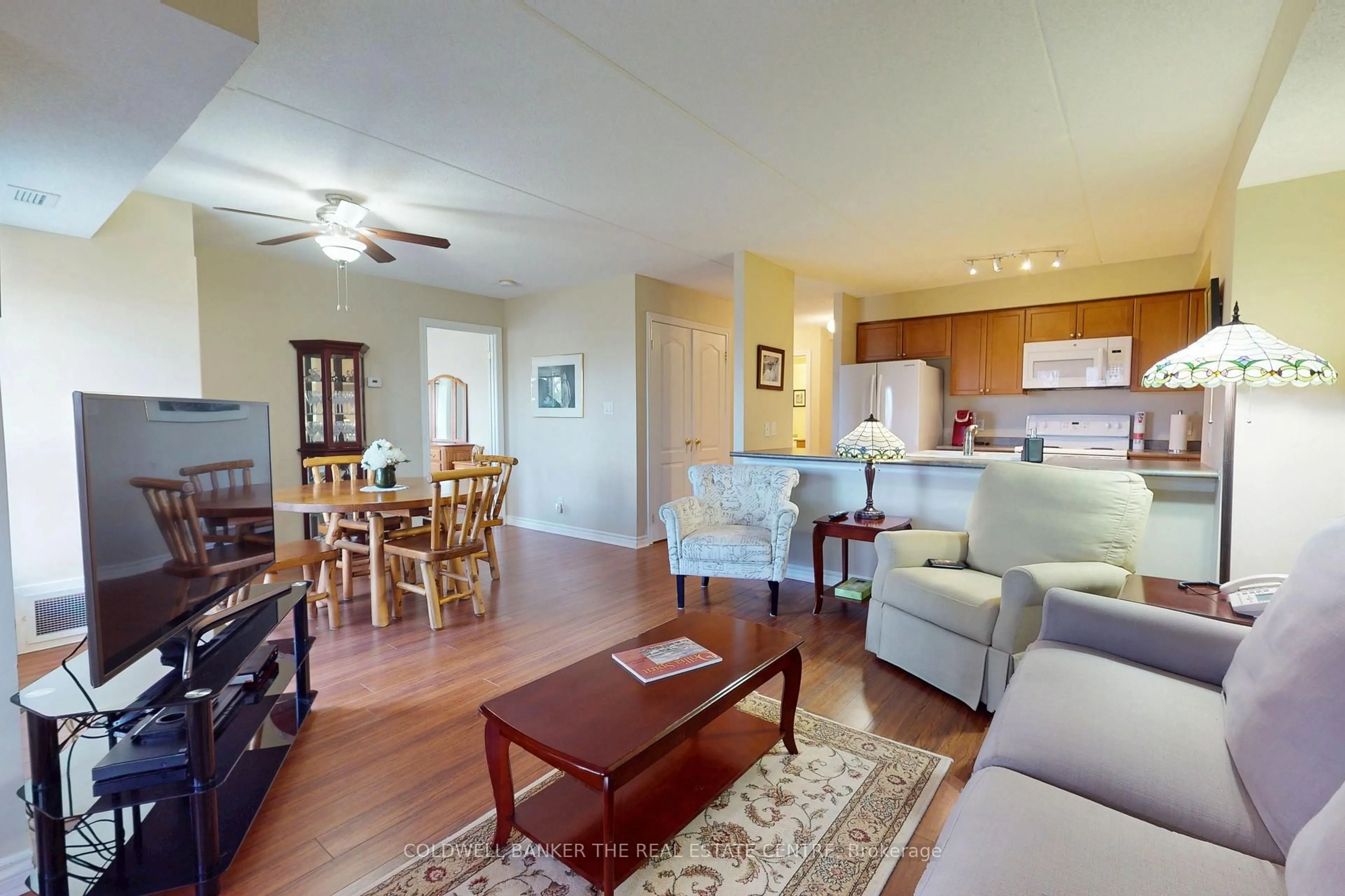 Living room with furniture, wood/laminate floor for 486 Laclie St #304, Orillia Ontario L3V 4P9